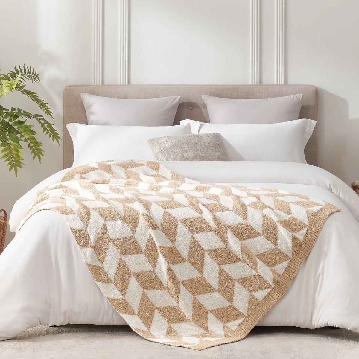 Chevron Feather Yarn Knit Throw Blanket in Beige styled on a bed, highlighting soft texture and modern chevron pattern in a bright bedroom setting. #color_Beige