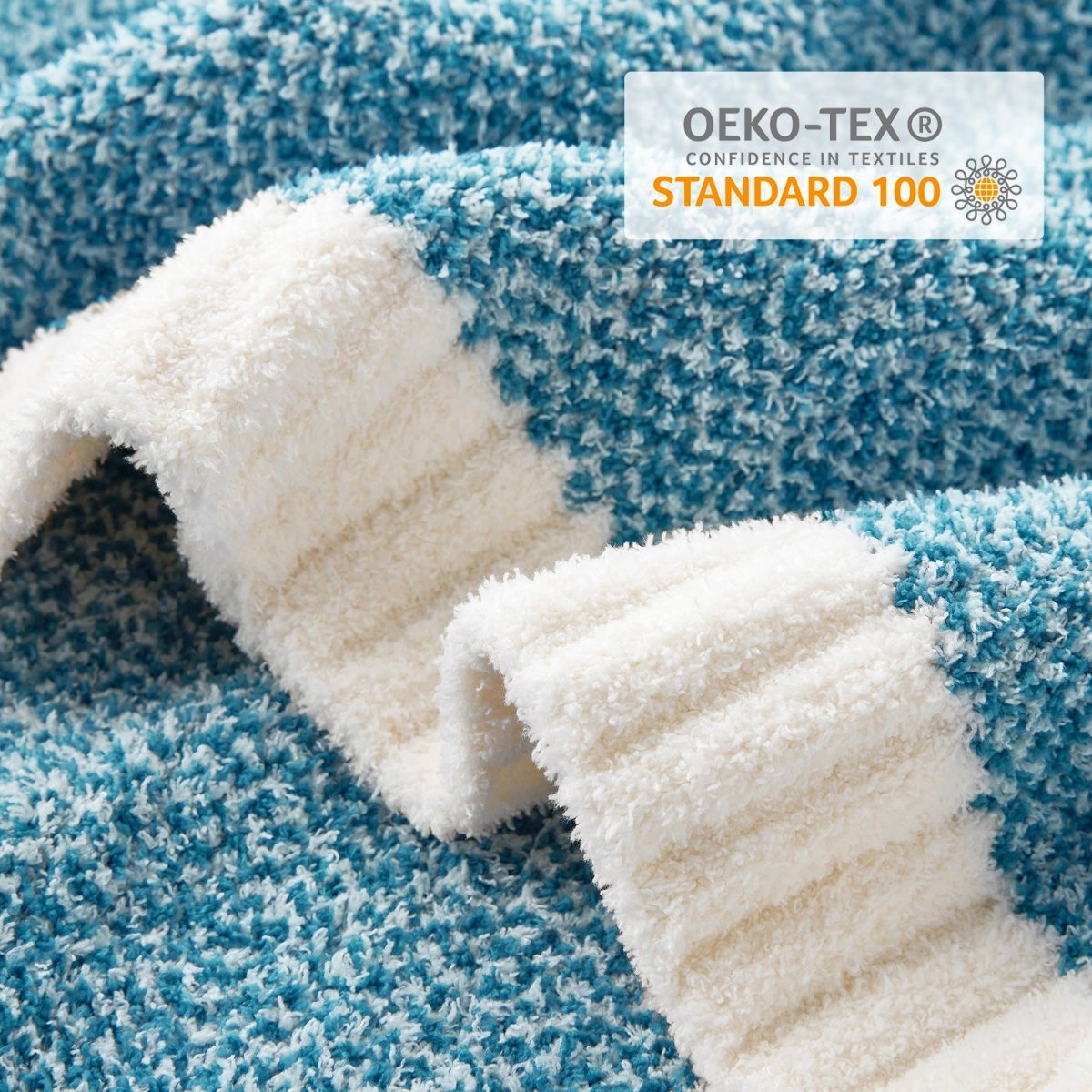 Close-up of Heather Feather Yarn Throw Blanket in Heather Teal showcasing plush texture and OEKO-TEX STANDARD 100 certification. #color_Heather Teal