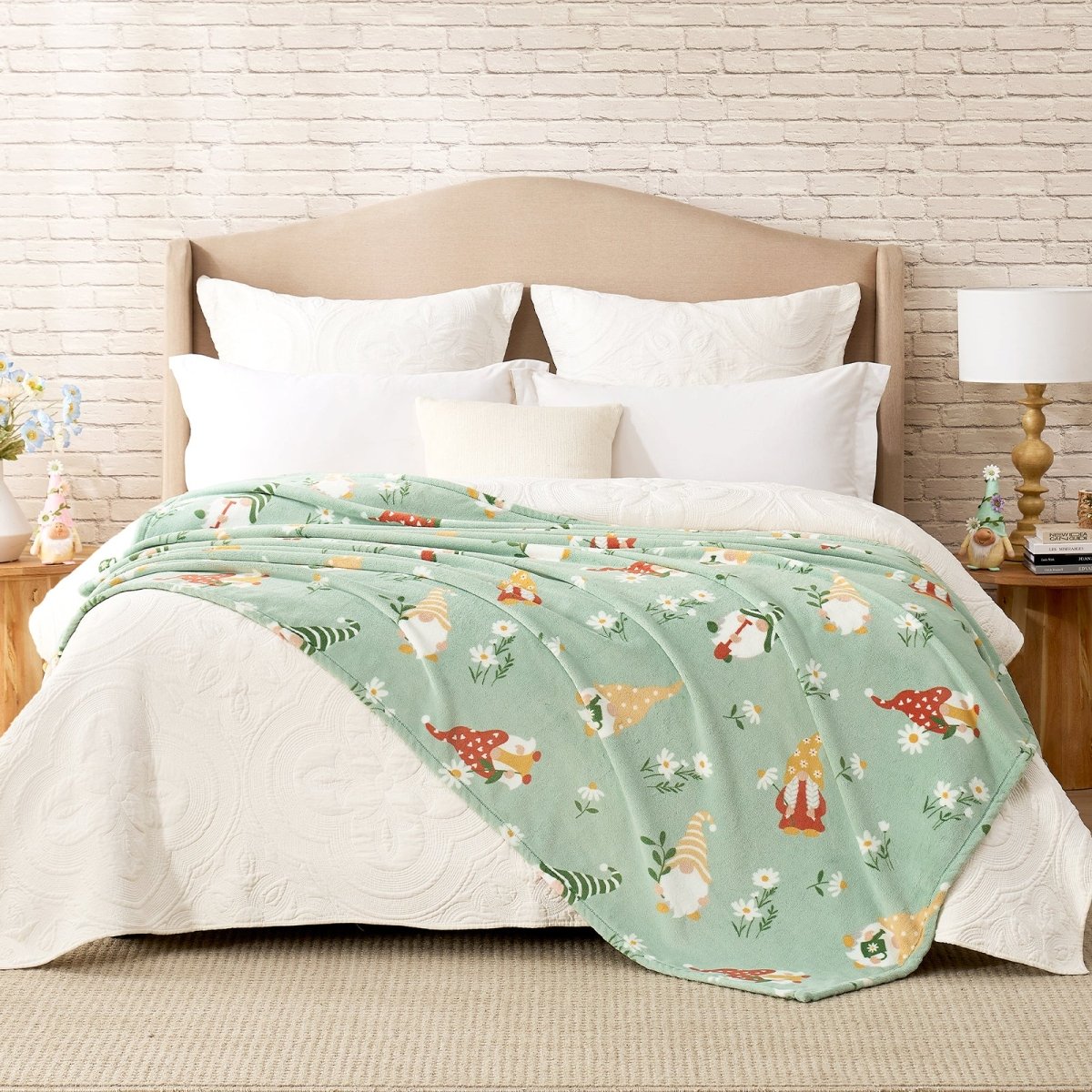 Spring gnomes milkyplush throw blanket in Green layered on a bed, creating a warm and playful bedroom look #color_Sage Green