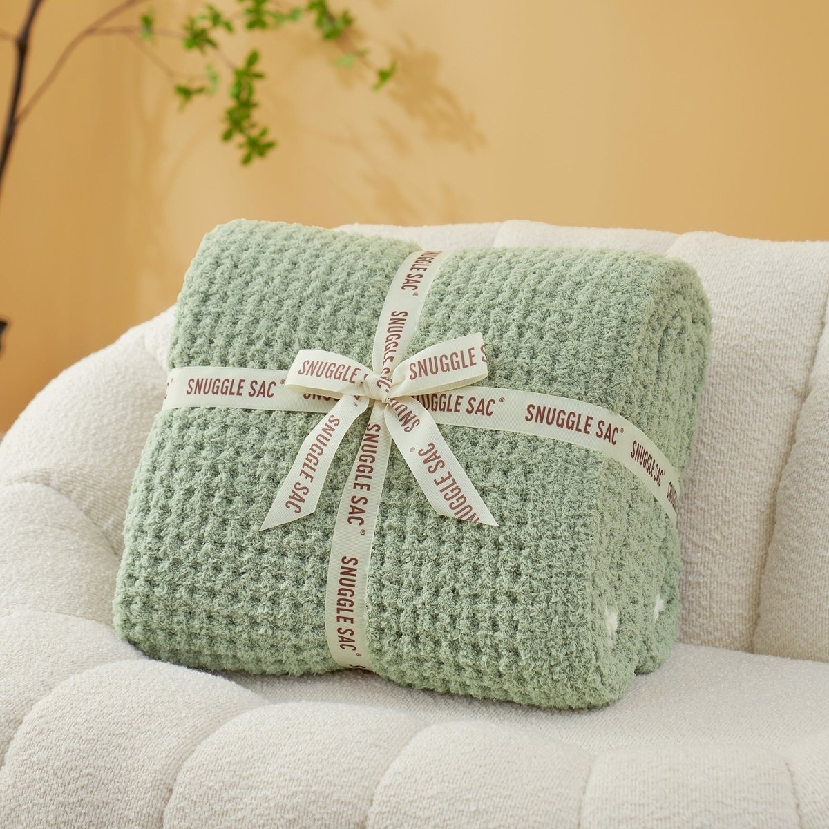 Soft Waffle Feather Yarn Throw Blanket in Sage Green neatly folded as gift packaging, ideal for gifting occasions. #color_Sage Green