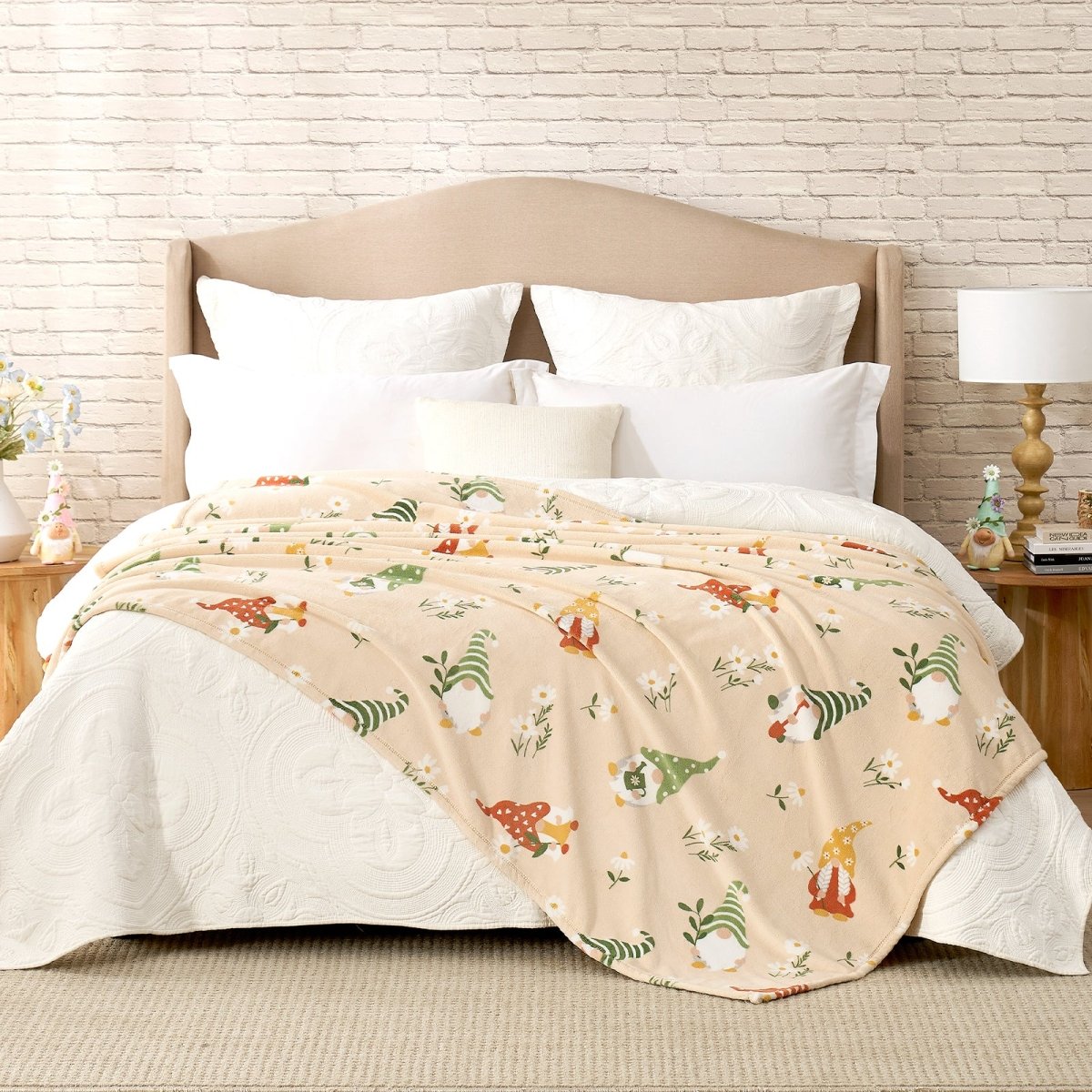 Spring gnomes milkyplush throw blanket in Beige layered on a bed, creating a warm and playful bedroom look #color_Beige