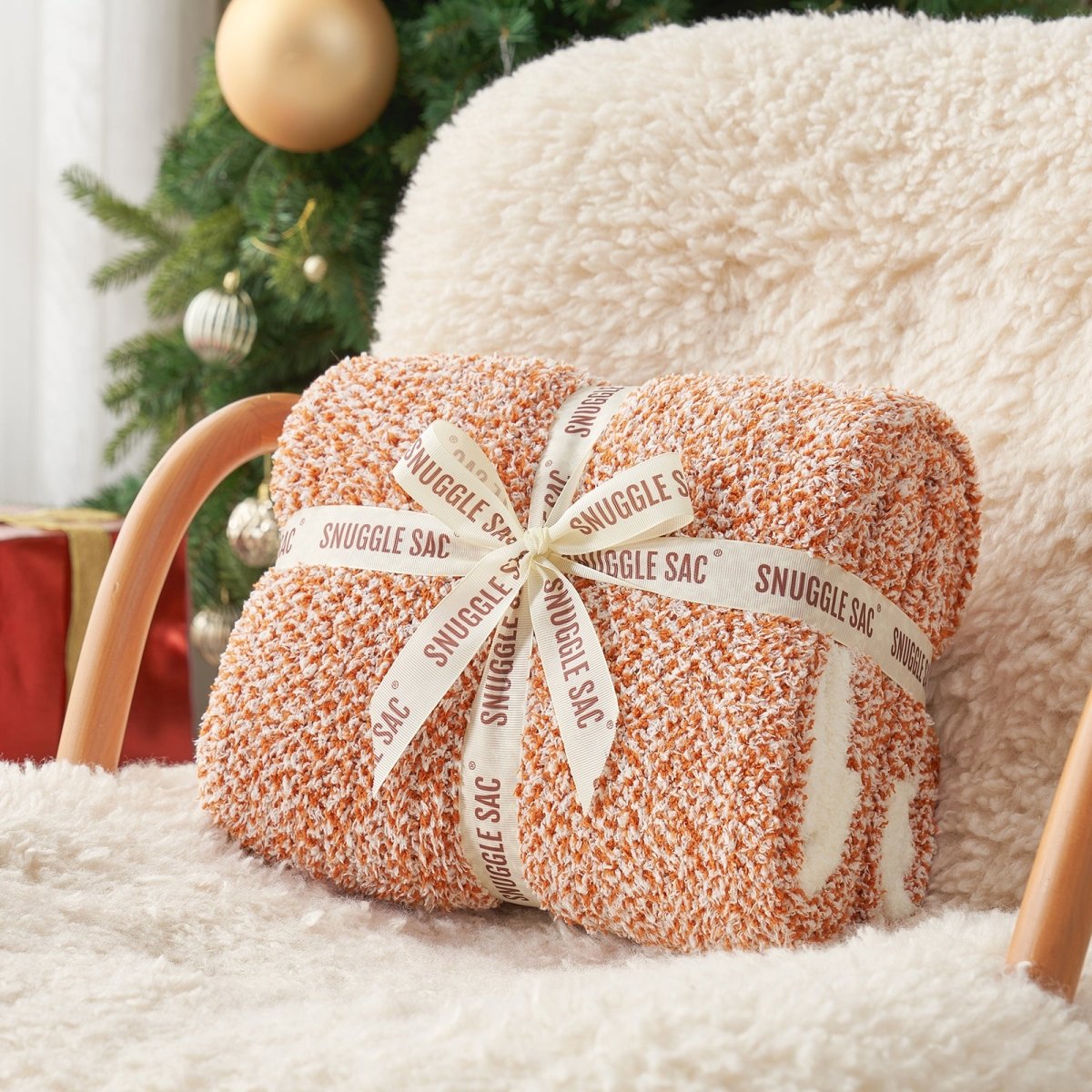 Heather Feather Yarn Throw Blanket in orange neatly folded with ribbon, a perfect gift idea for holidays, housewarming or special occasions.  #Color_Orange