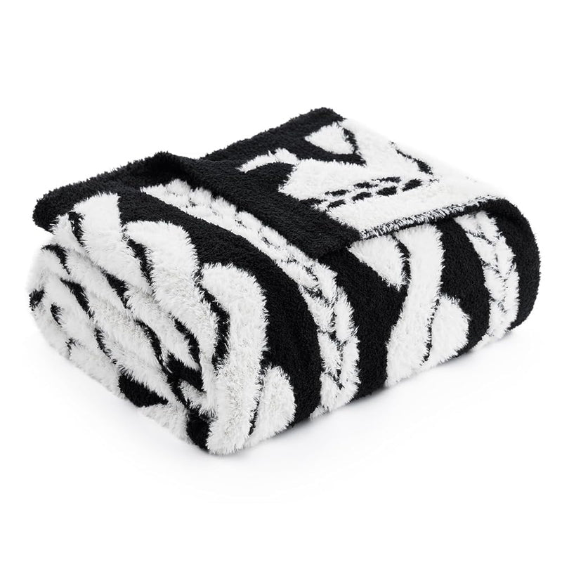 Black and white cable knit blanket on a white background #color_Black