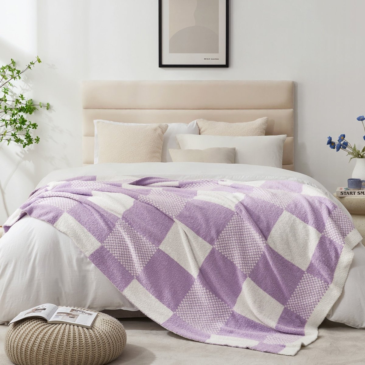 Checkered Feather Yarn Throw Blanket in Lilac styled on a bed, adding a soft and cozy layered look. #color_Lilac