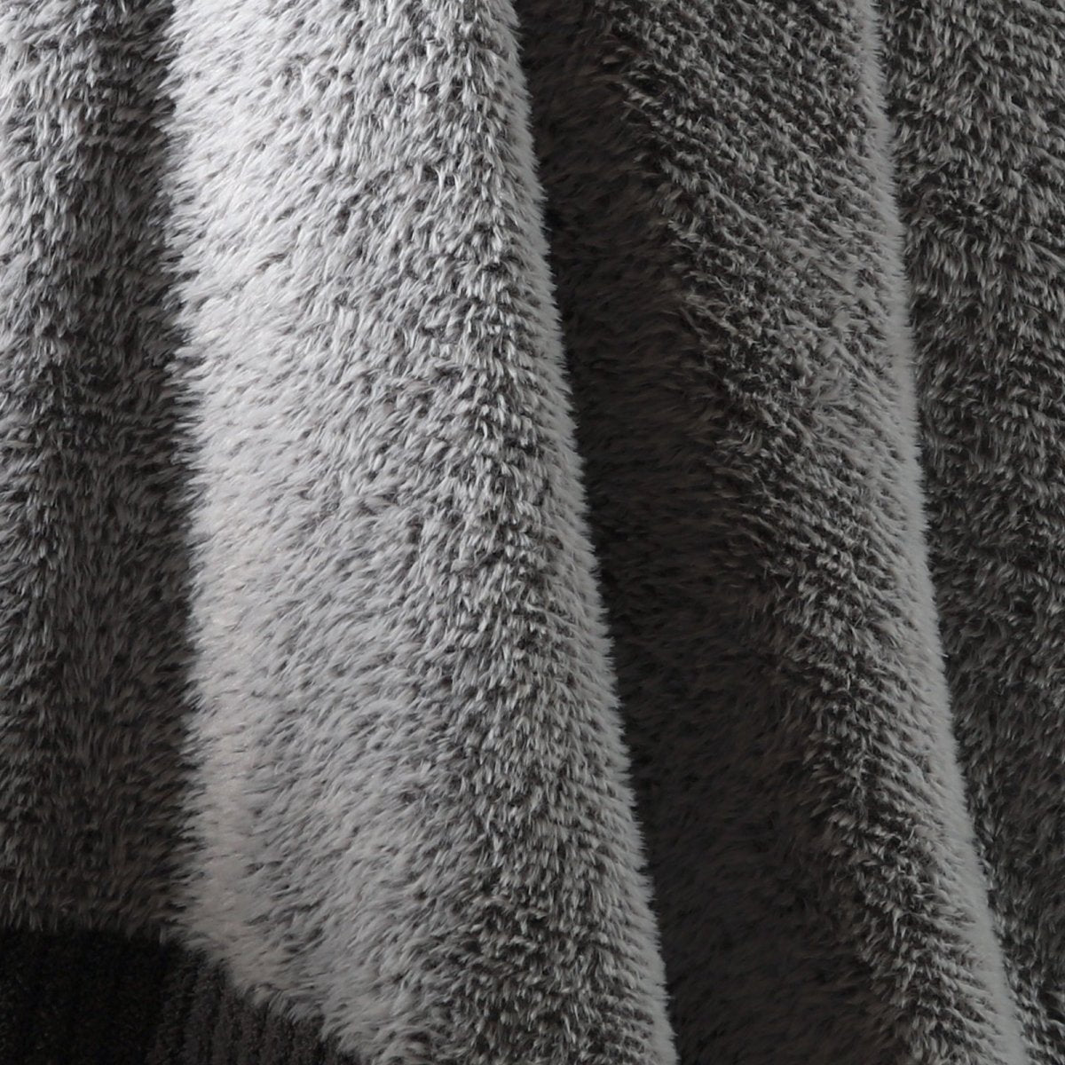 Macro close-up of faux mink fibers on Faux Mink Feather Knit Throw Blanket in Grey showcasing ultra soft and fluffy texture detail. #color_Grey