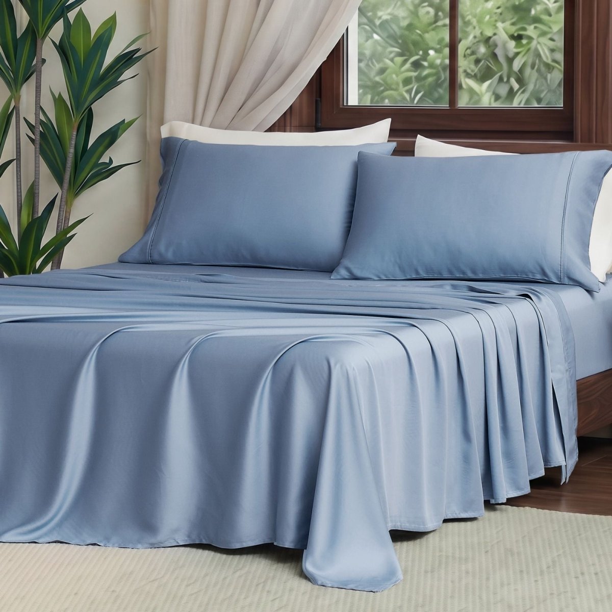 Front view of Cozy Bliss Tencel™ Eco-friendly Silky Sheet Set on a bed, showcasing smooth drape and elegant bedding style. #color_Dark Blue