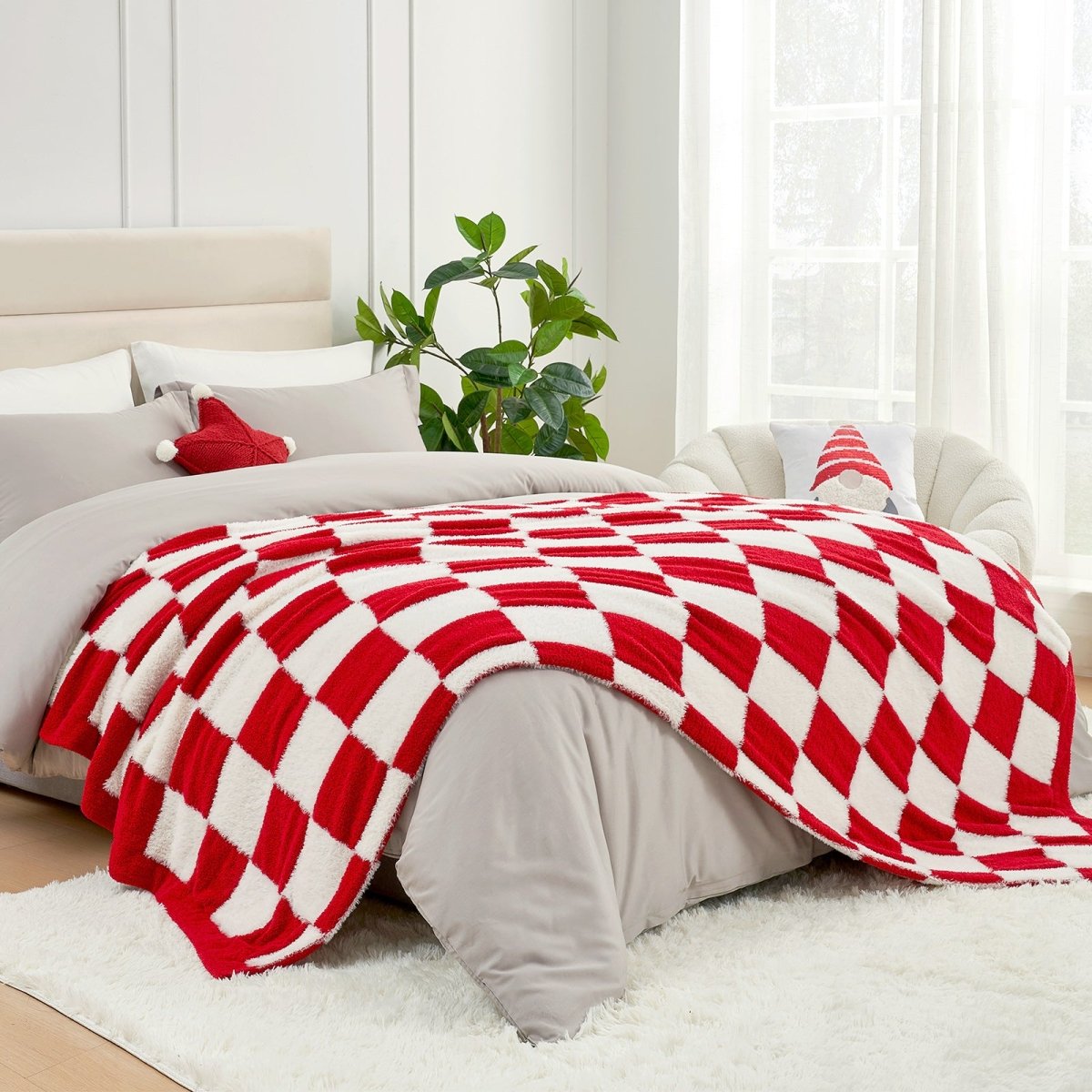Checkered Faux Fur Feather Yarn Throw Blanket in Red & Cream styled on a bed, creating a cozy feel. #color_Red & Cream