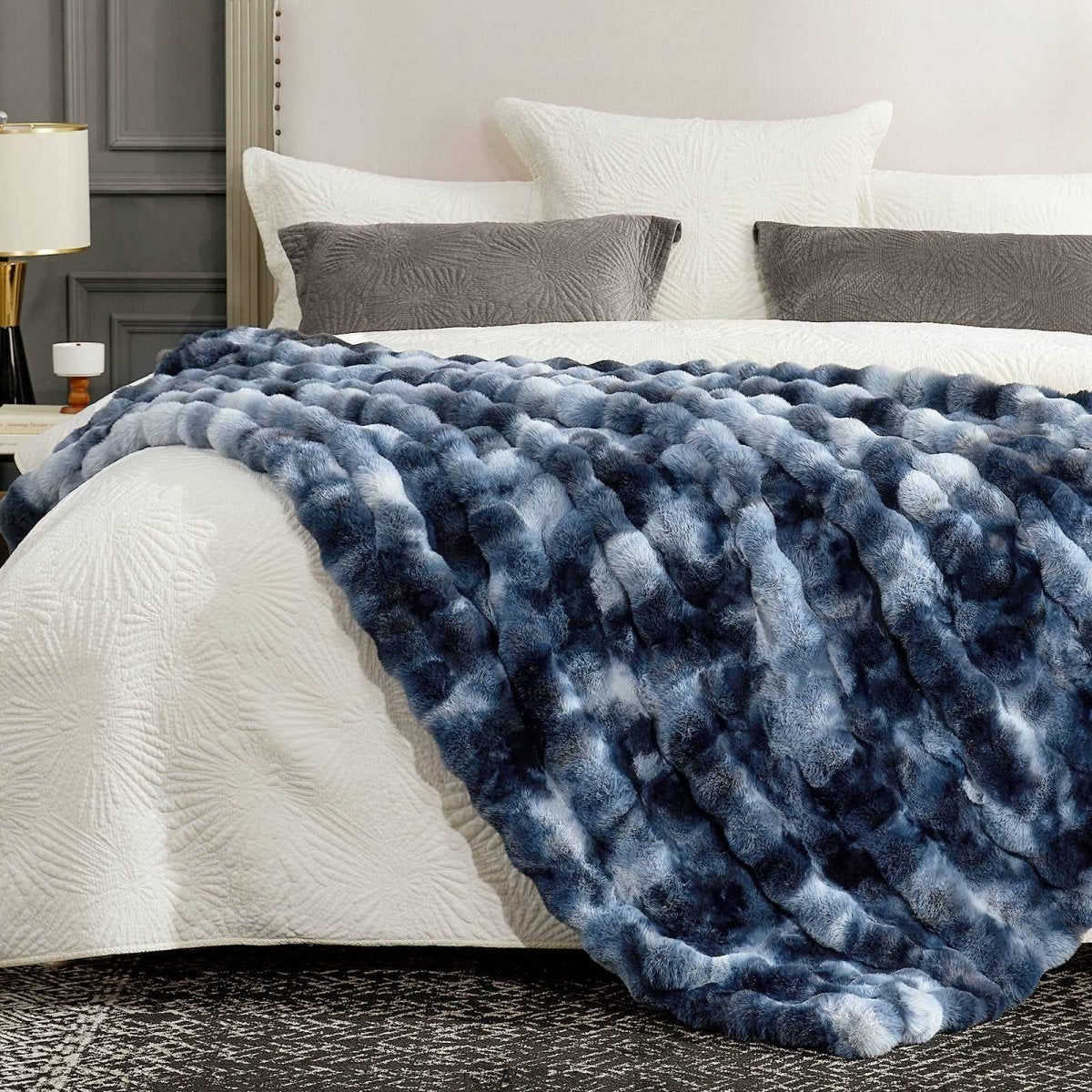 Tie-dye blue faux fur blanket on cozy bed. Cozy and soft blanket for bedroom comfort.  #color_Tie-dye Blue