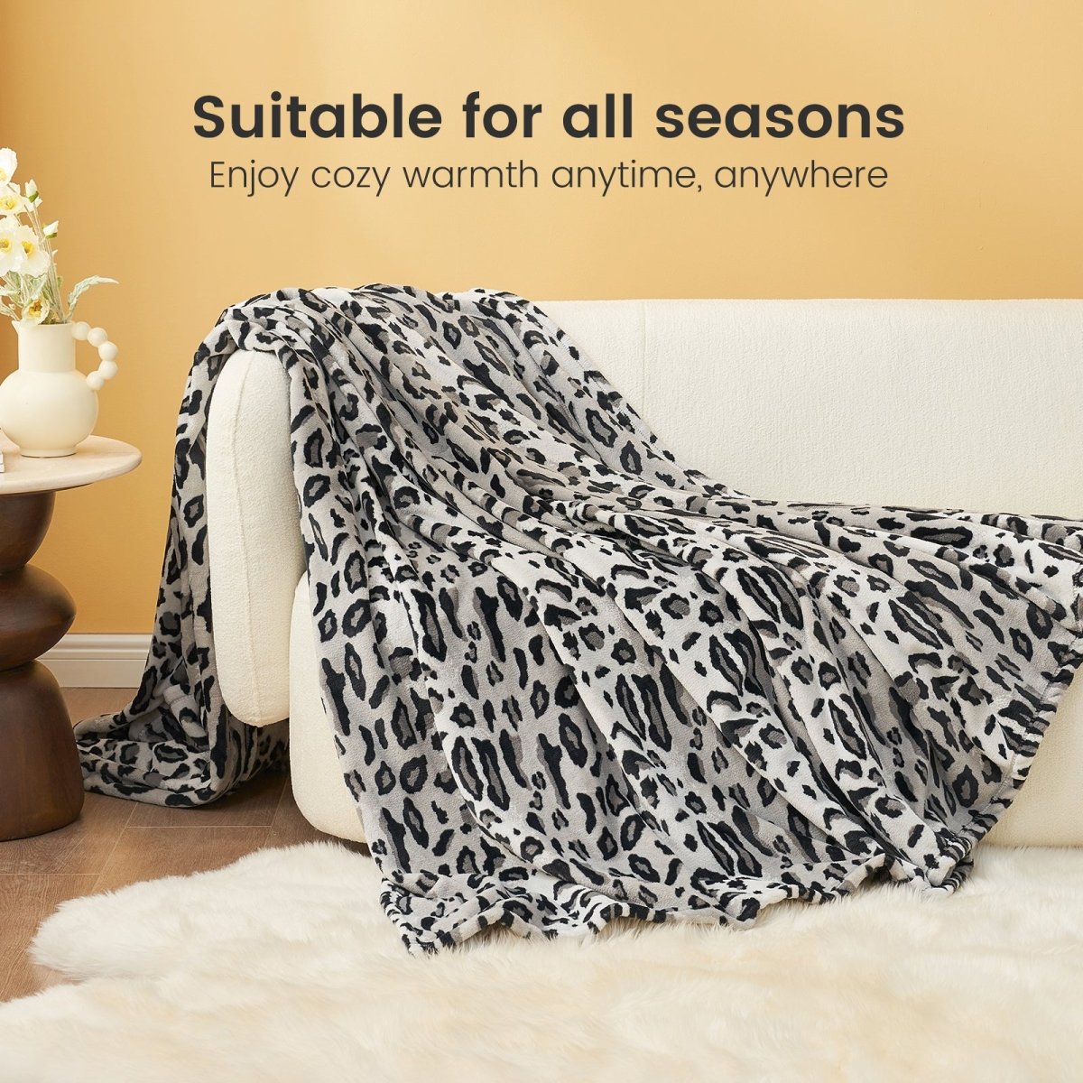 Leopard print blanket on a white sofa, suitable for all seasons, for cozy warmth. #color_Snow Leopard