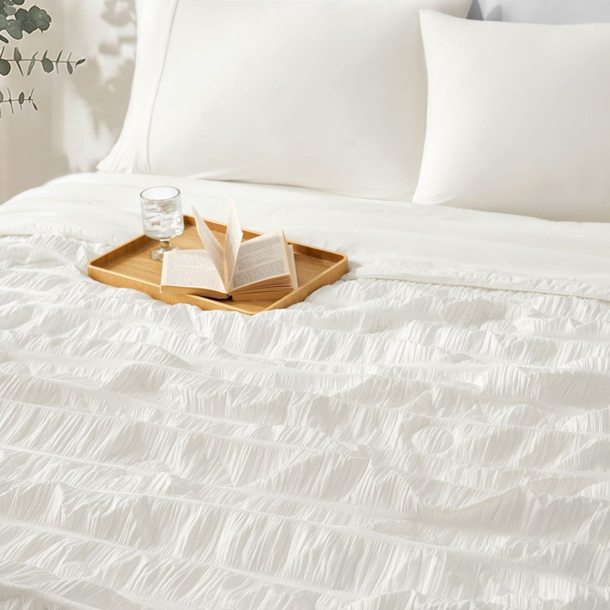 Close-up of Cozy Bliss Vertical Striped Seersucker Cooling Comforter. #color_Off White