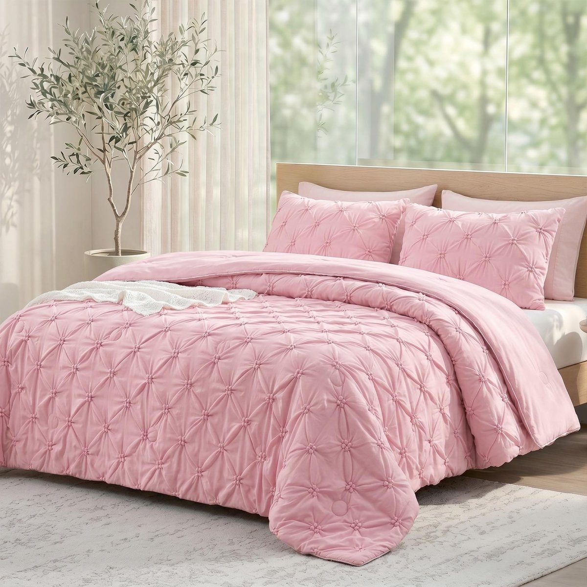 Cozy Bliss pink pintuck design cooling comforter on a bed, designed for hot sleepers and night sweats.#color_Pink