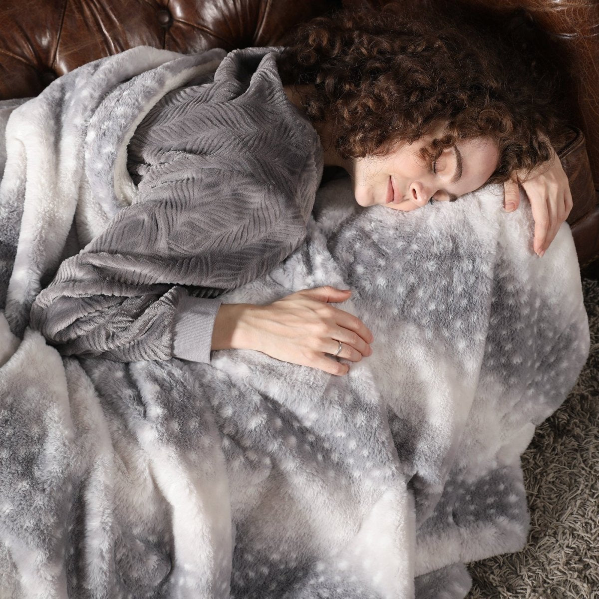 Person wrapped in a gray blanket on a couch   #color_Silver Sherpa Deer