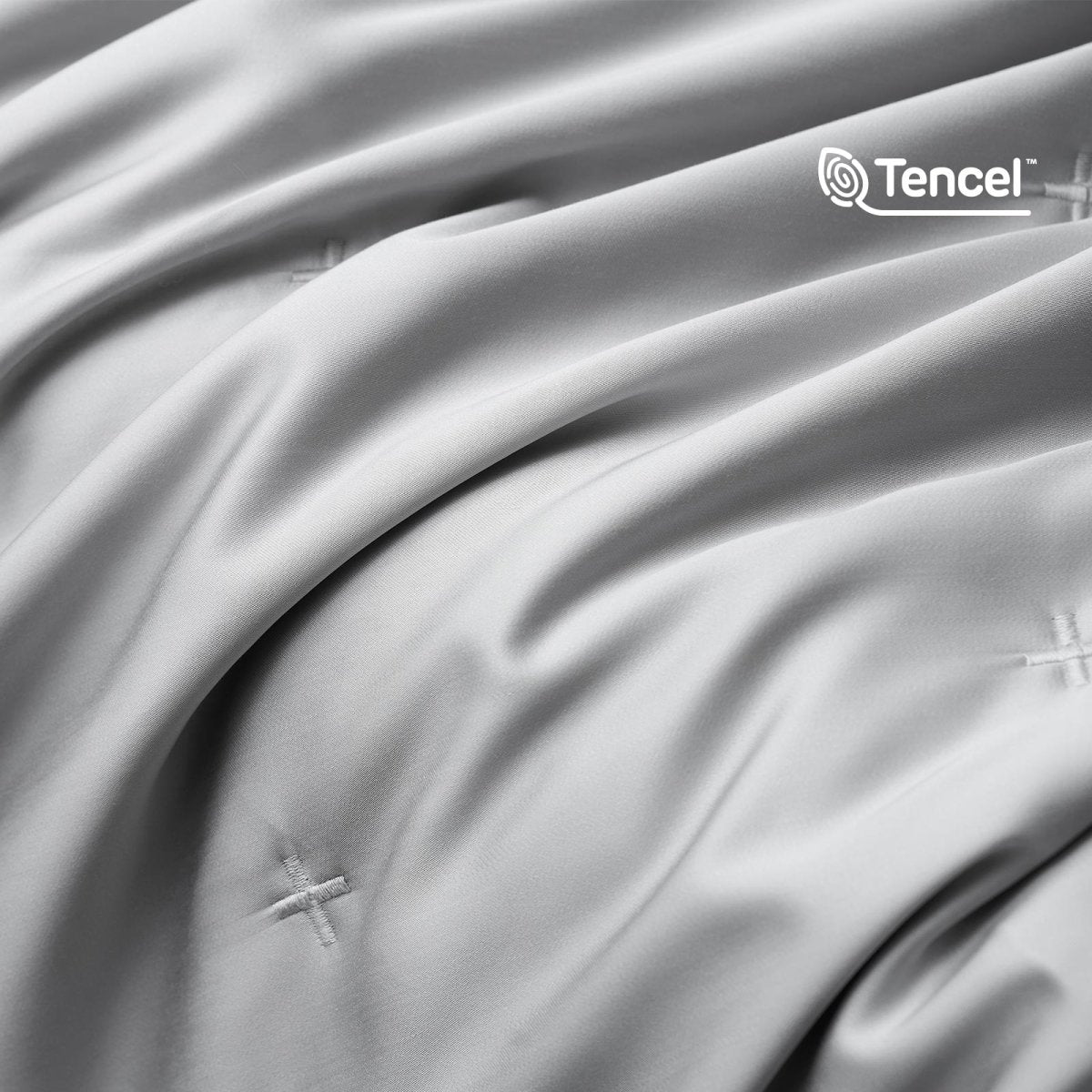 Close up of silky smooth Tencel™ lyocell cooling fabric with OKEO-TEX Standard 100 certification.#Color_Grey