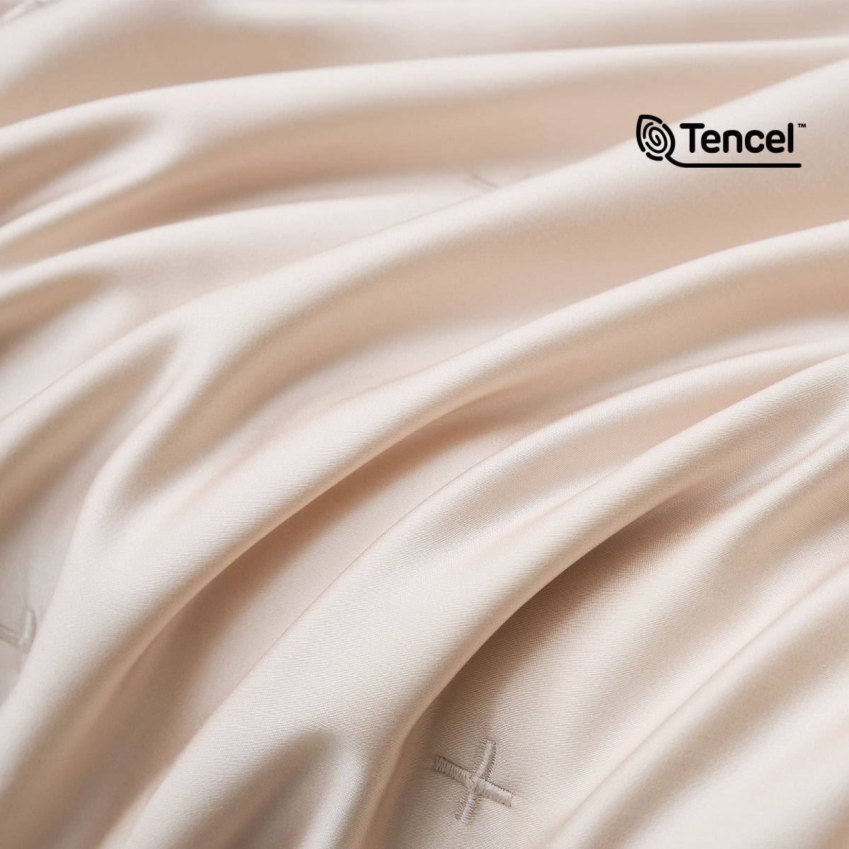 Close up of silky smooth Tencel™ lyocell cooling fabric with OKEO-TEX Standard 100 certification.#Color_Champagne