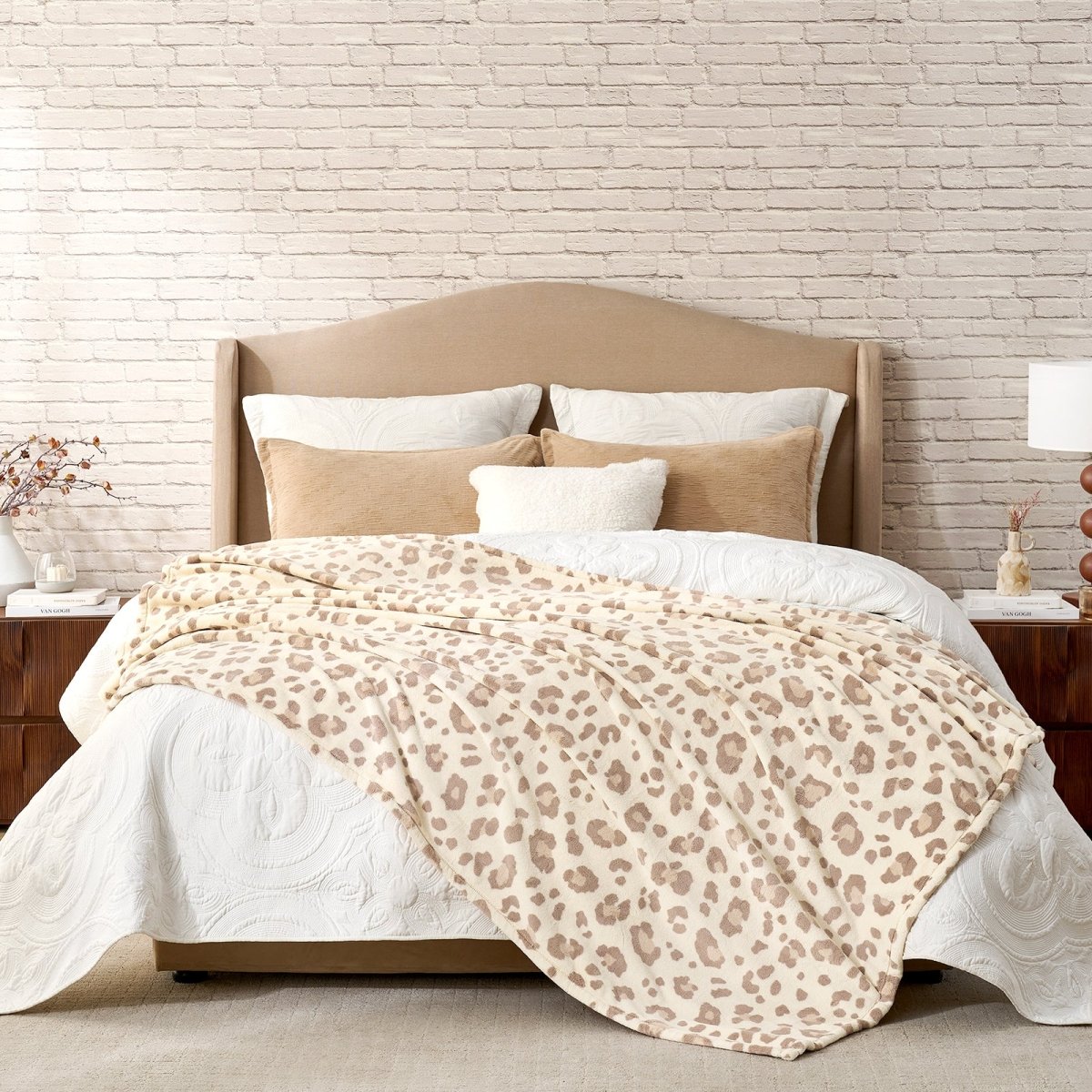Leopard print milkyplush throw blanket in Khaki Leopard layered on a bed, creating a warm and stylish bedroom look #color_Khaki Leopard