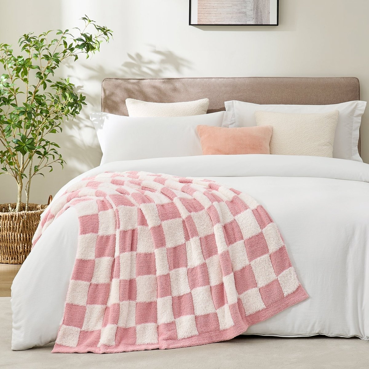 Checkered Faux Fur Feather Yarn Throw Blanket in Pink White styled on a bed, adding a cozy and stylish look. #Color_Pink white