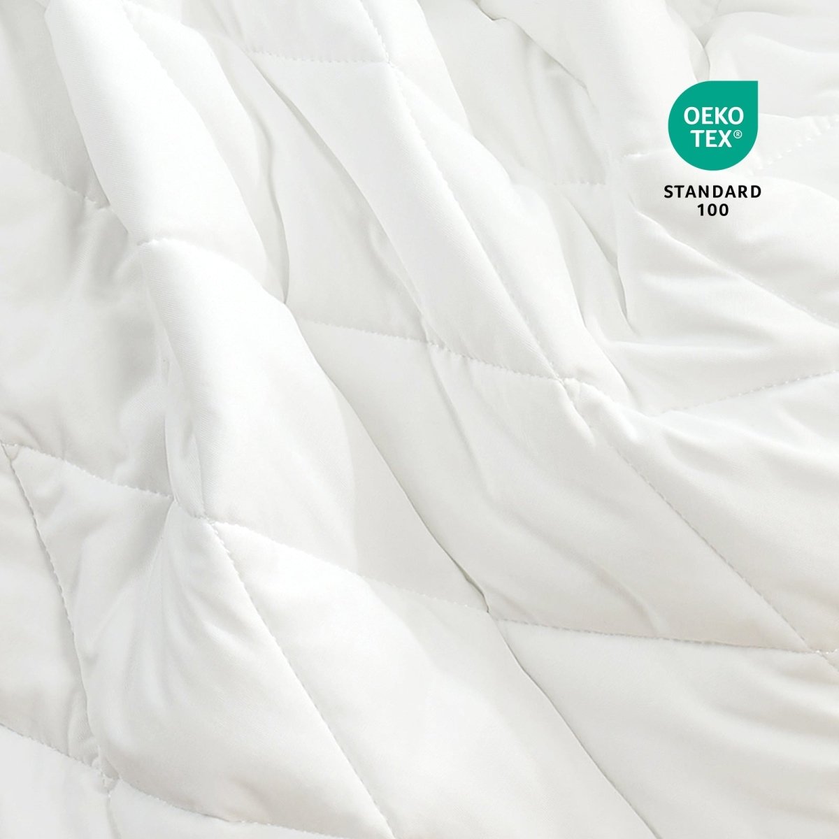 Close-up of Cozy Bliss fabric with OEKO-TEX standard 100 certification.#color_Off White