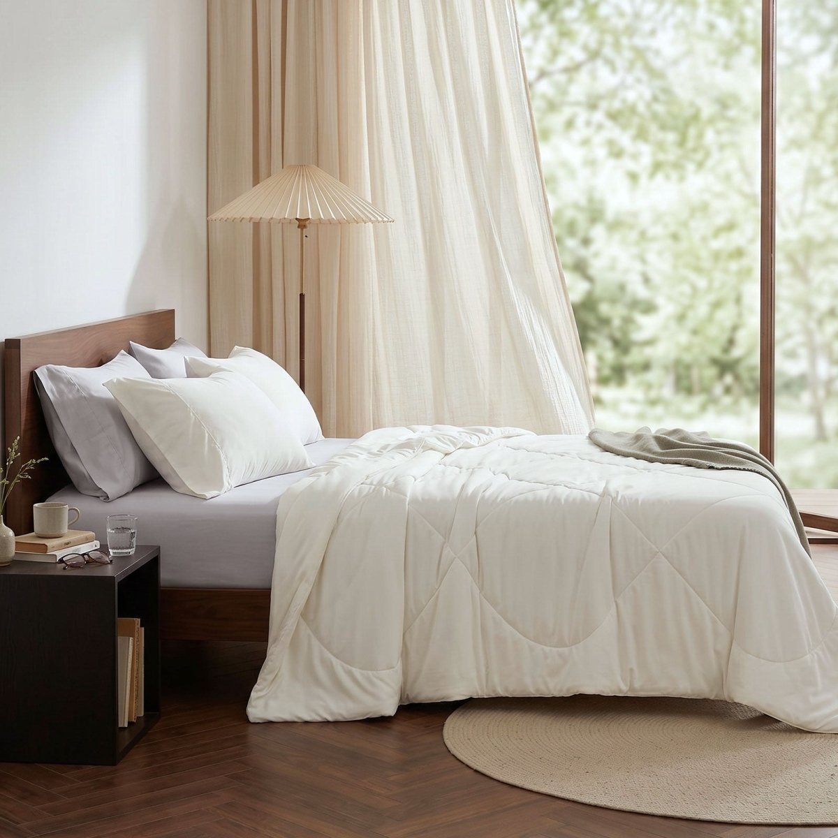 Cozy Bliss cooling comforter on bed in side view. Breathable, soft fabric for hot sleepers. #Color_Off White