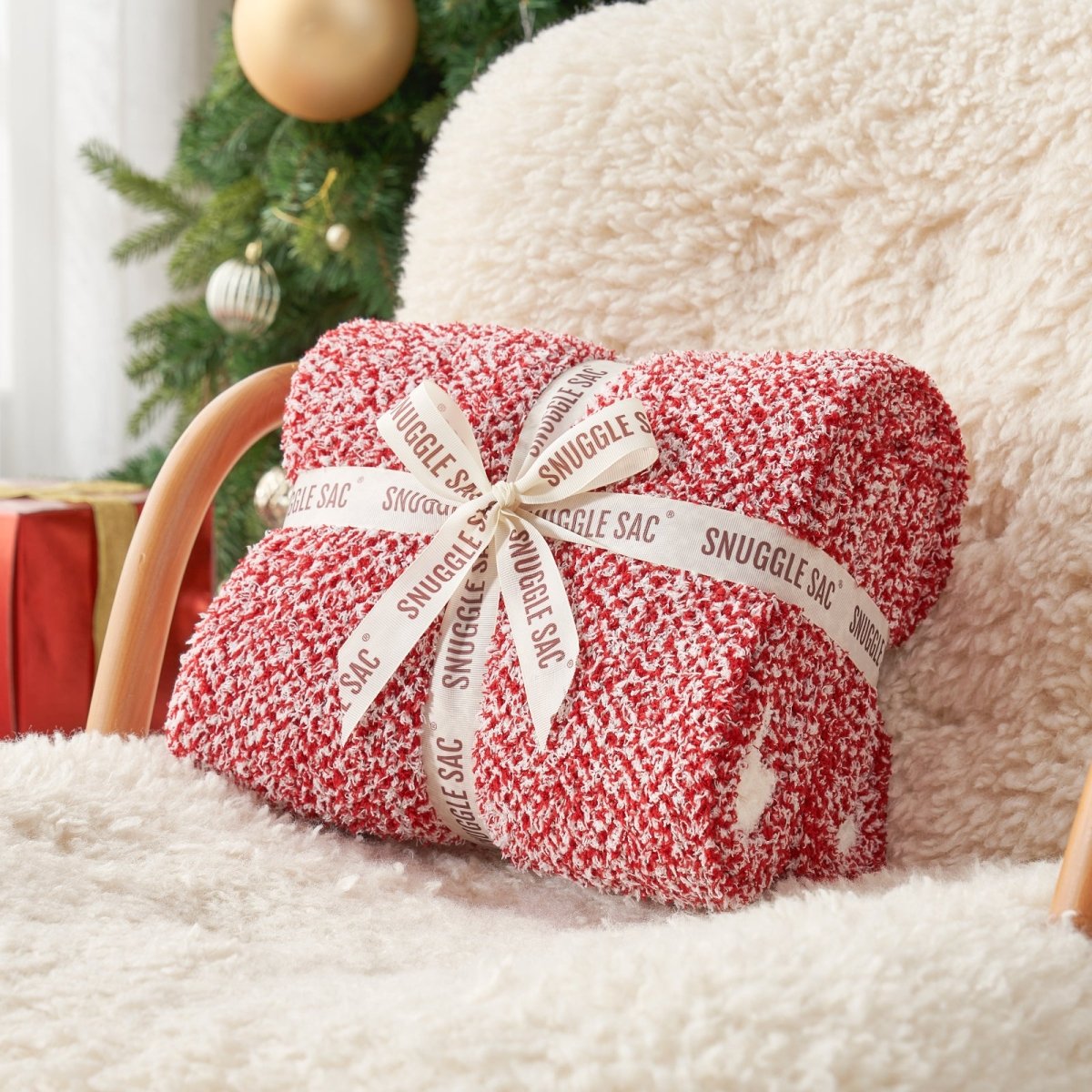 Heather Feather Yarn Throw Blanket in Christmas red neatly folded with ribbon, a perfect gift idea for holidays, housewarming or special occasions.  #Color_Christmas Red