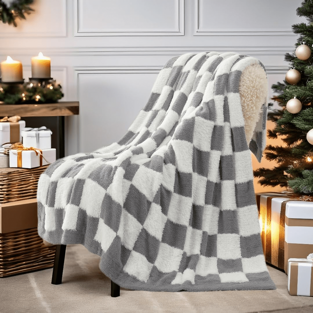 Checkered Faux Fur Feather Yarn Throw Blanket in Grey & White draped over a chair, adding a modern cozy feel. #color_Grey & White