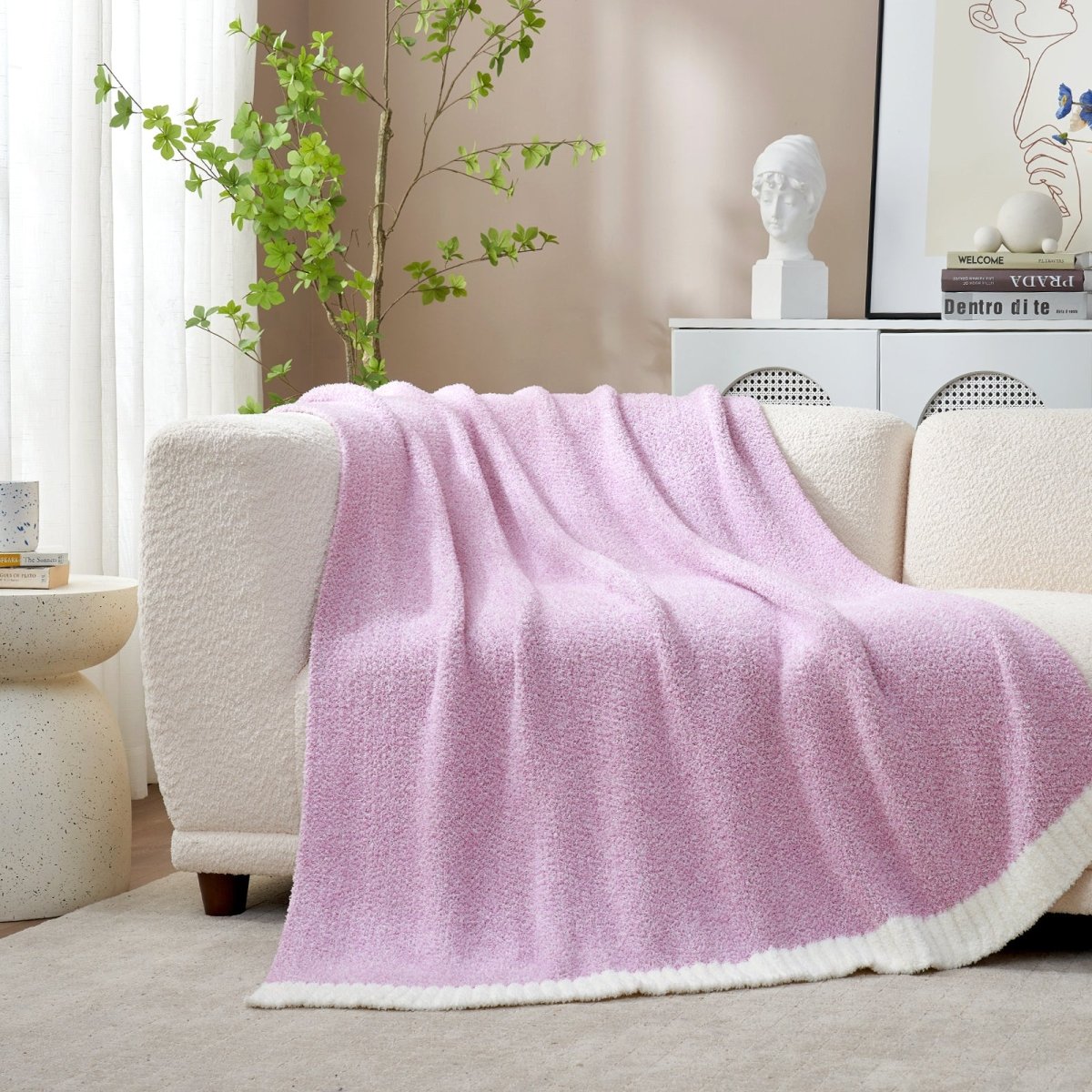 Heather Feather Yarn Throw Blanket in purple draped over a sofa, adding warmth, softness and a modern cozy touch to your living room. #Color_Purple