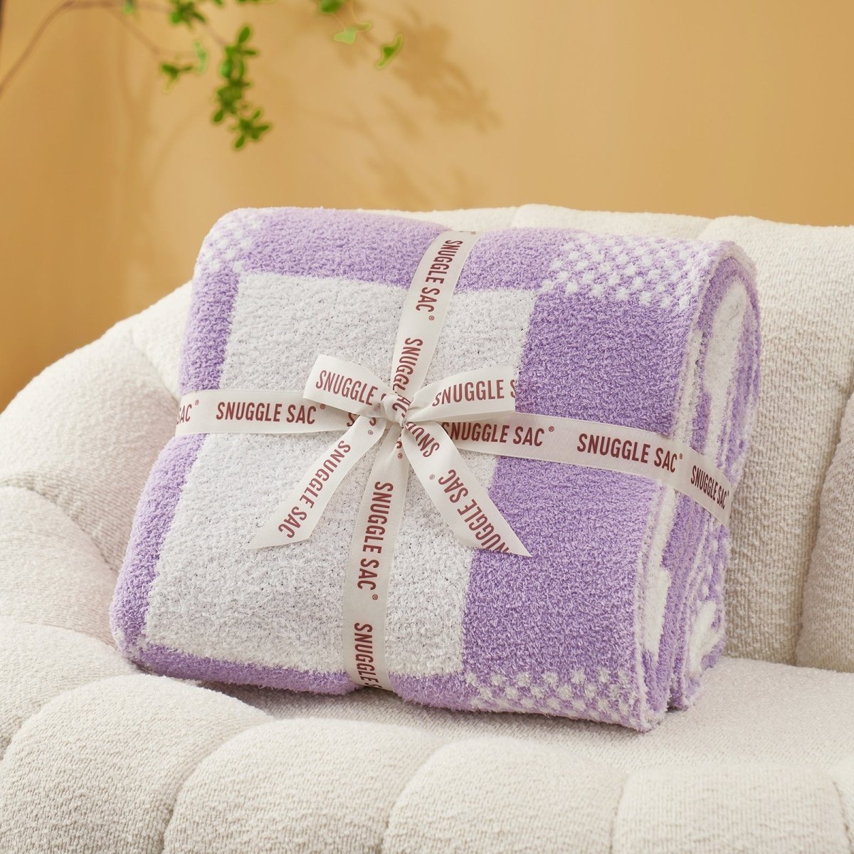 Checkered Feather Yarn Throw Blanket in Lilac neatly folded as gift packaging, perfect for holidays and special occasions. #color_Lilac