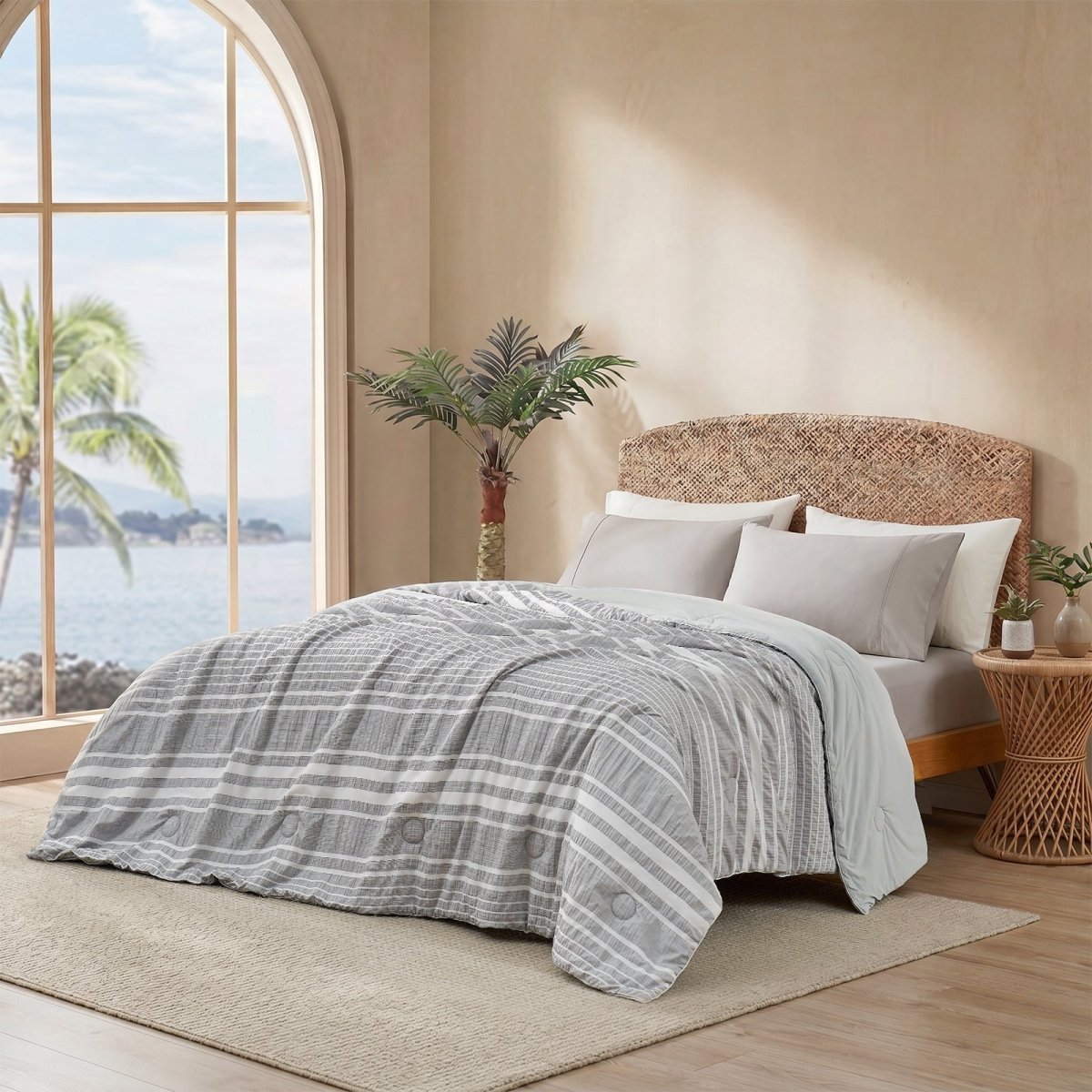 Cozy Bliss cationic dyed striped seersucker cooling comforter in Light Grey layered on a bed #color_Light Grey