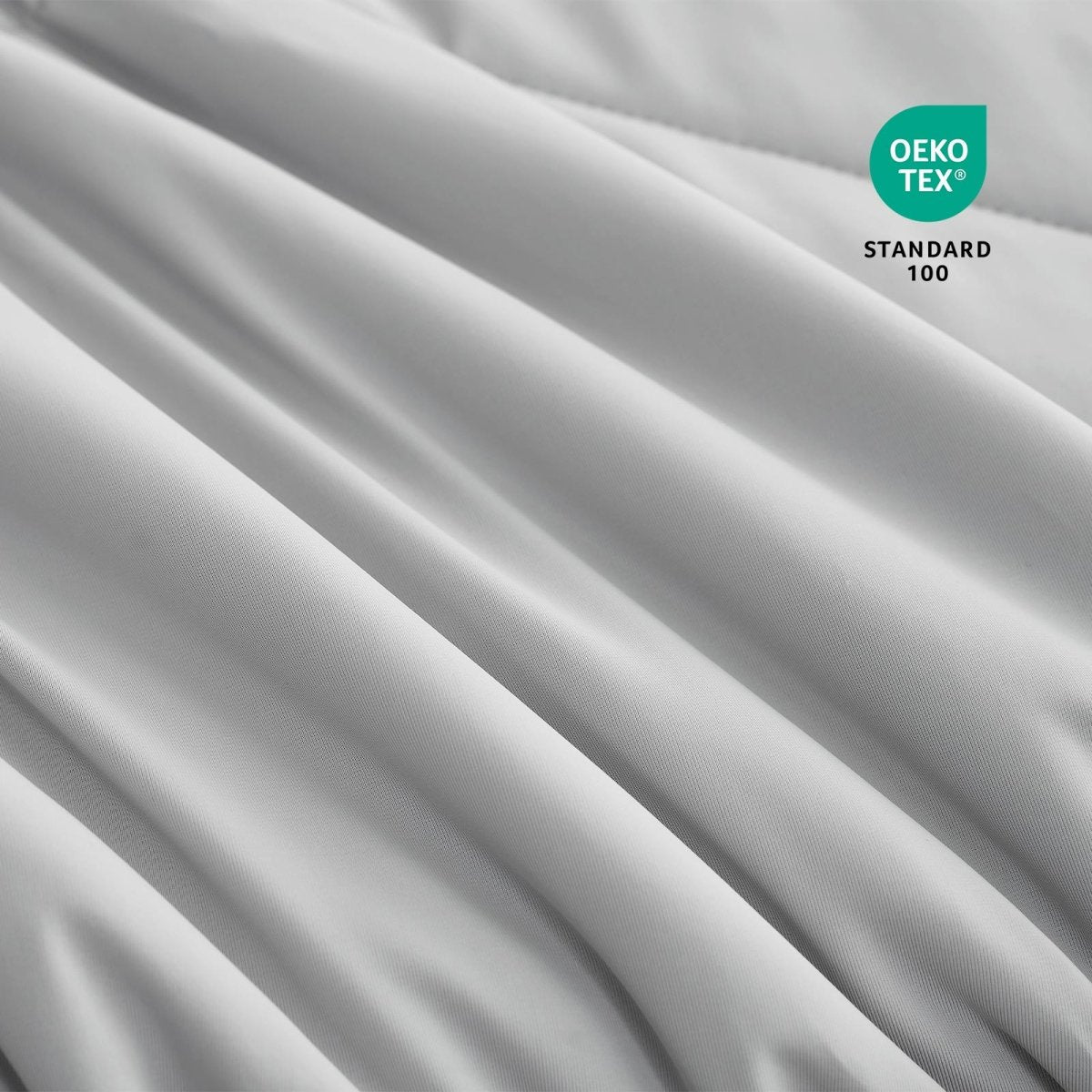 Close-up of OEKO-TEX certified cooling comforter fabric. #Color_Light Grey