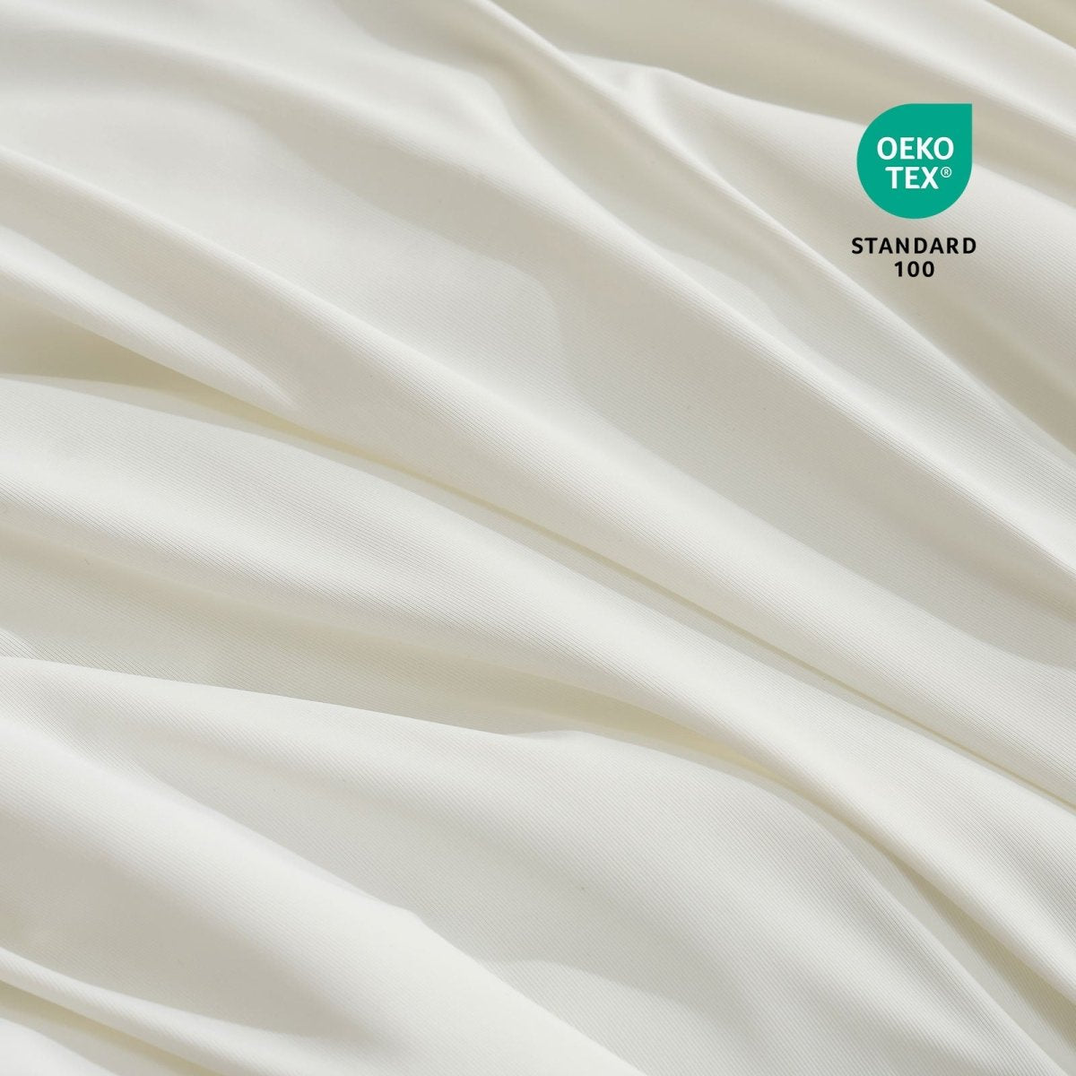 Close-up of OEKO-TEX certified cooling comforter fabric. #Color_Off White