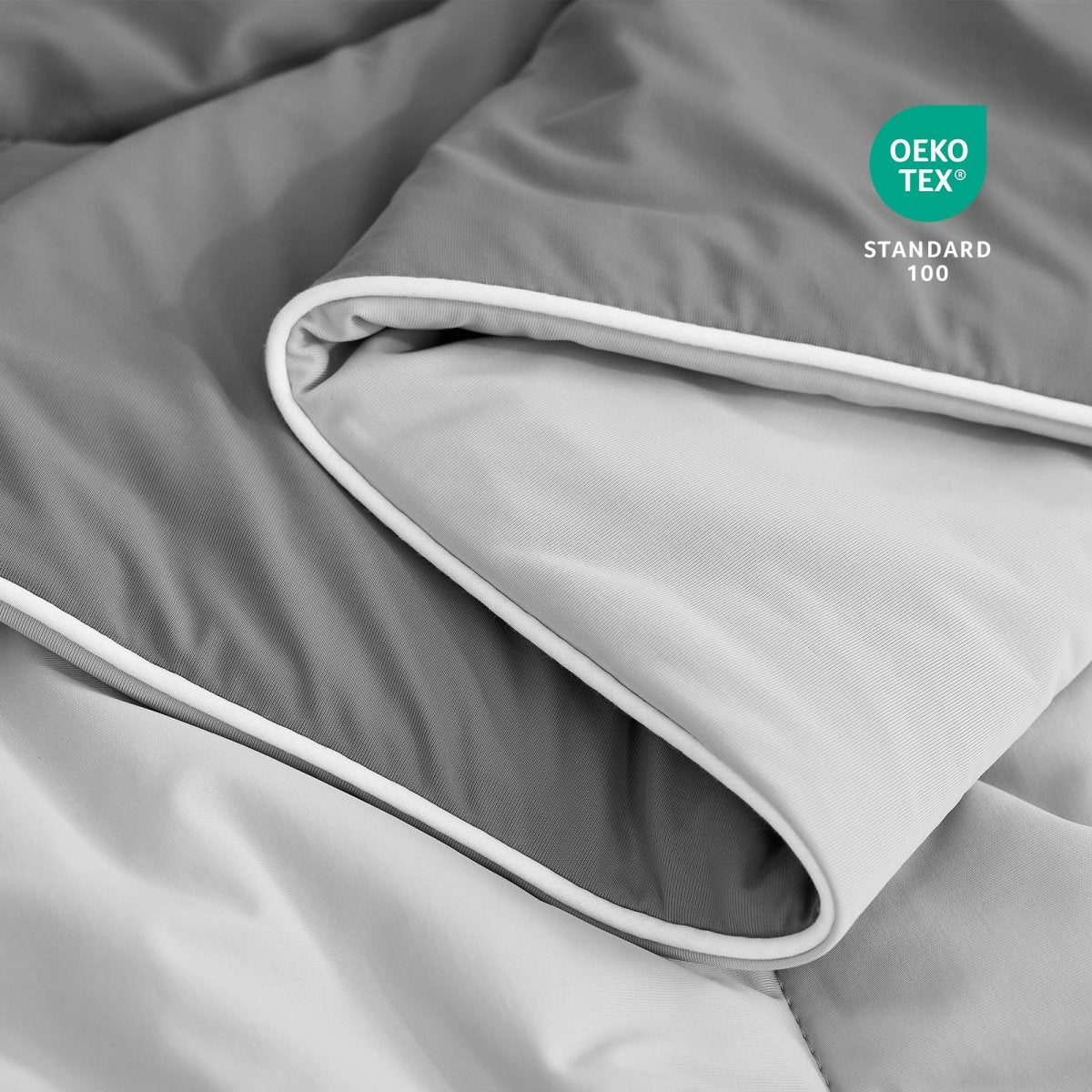 Close-up of OEKO-TEX certified cooling comforter fabric. #Color_Dark/Light Grey