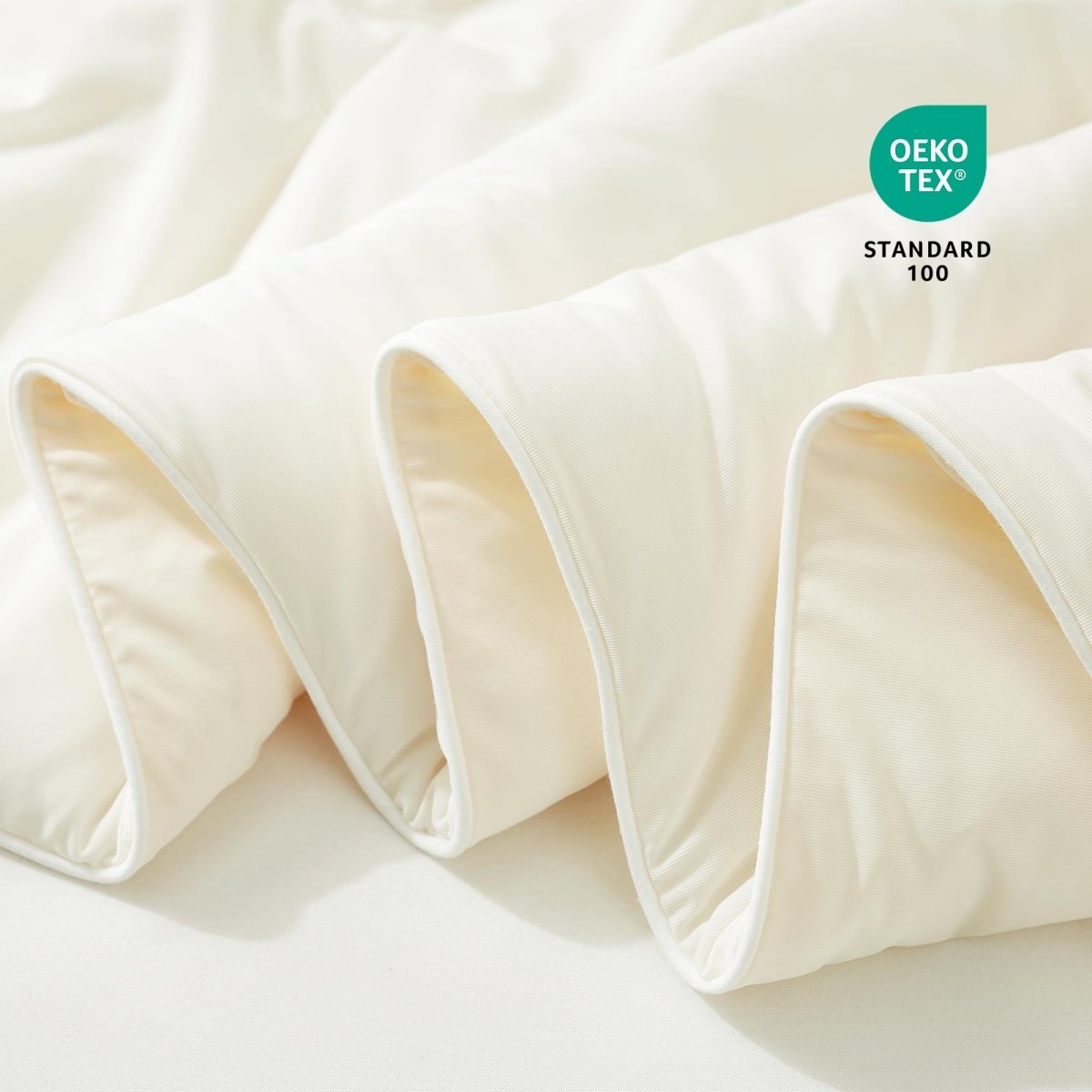 Close-up of white fabric with Oeko-Tex Standard 100 certification.#color_Ivory