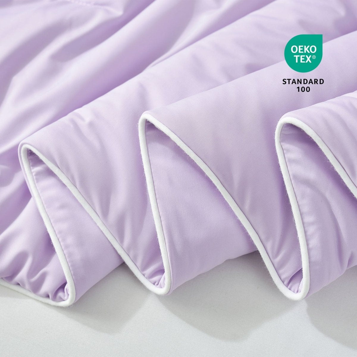 Close-up of purple fabric with Oeko-Tex Standard 100 certification.#color_Purple