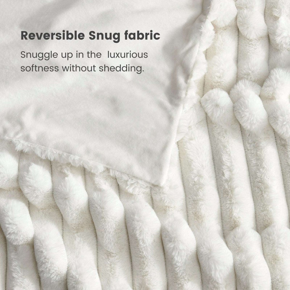 Close-up of Cozy Bliss Reversible faux fur blanket fabric #color_Cream White