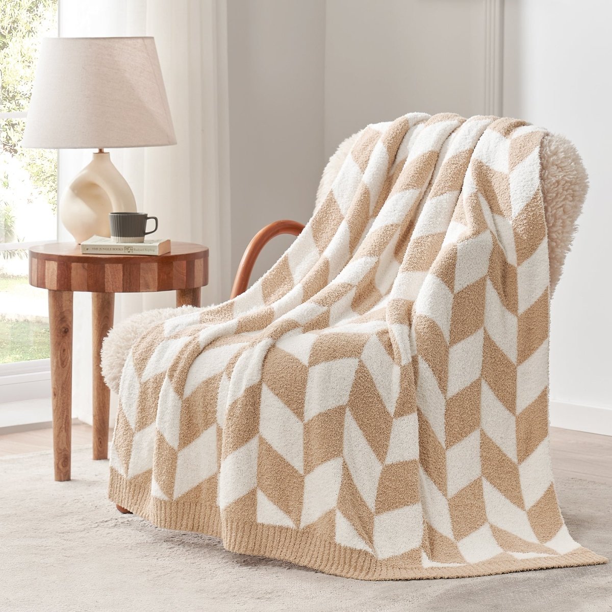 Chevron Feather Yarn Knit Throw Blanket in Beige draped over an armchair, showcasing soft feather yarn texture and chevron pattern design. #color_Beige