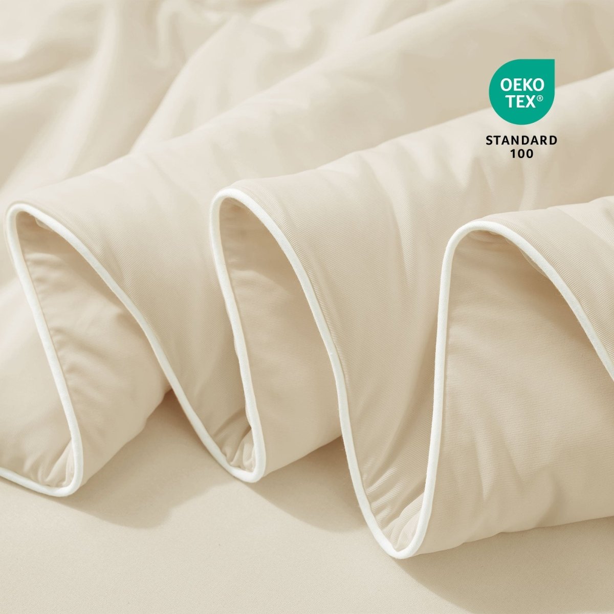 Close-up of beige fabric with Oeko-Tex Standard 100 certification.#color_Beige