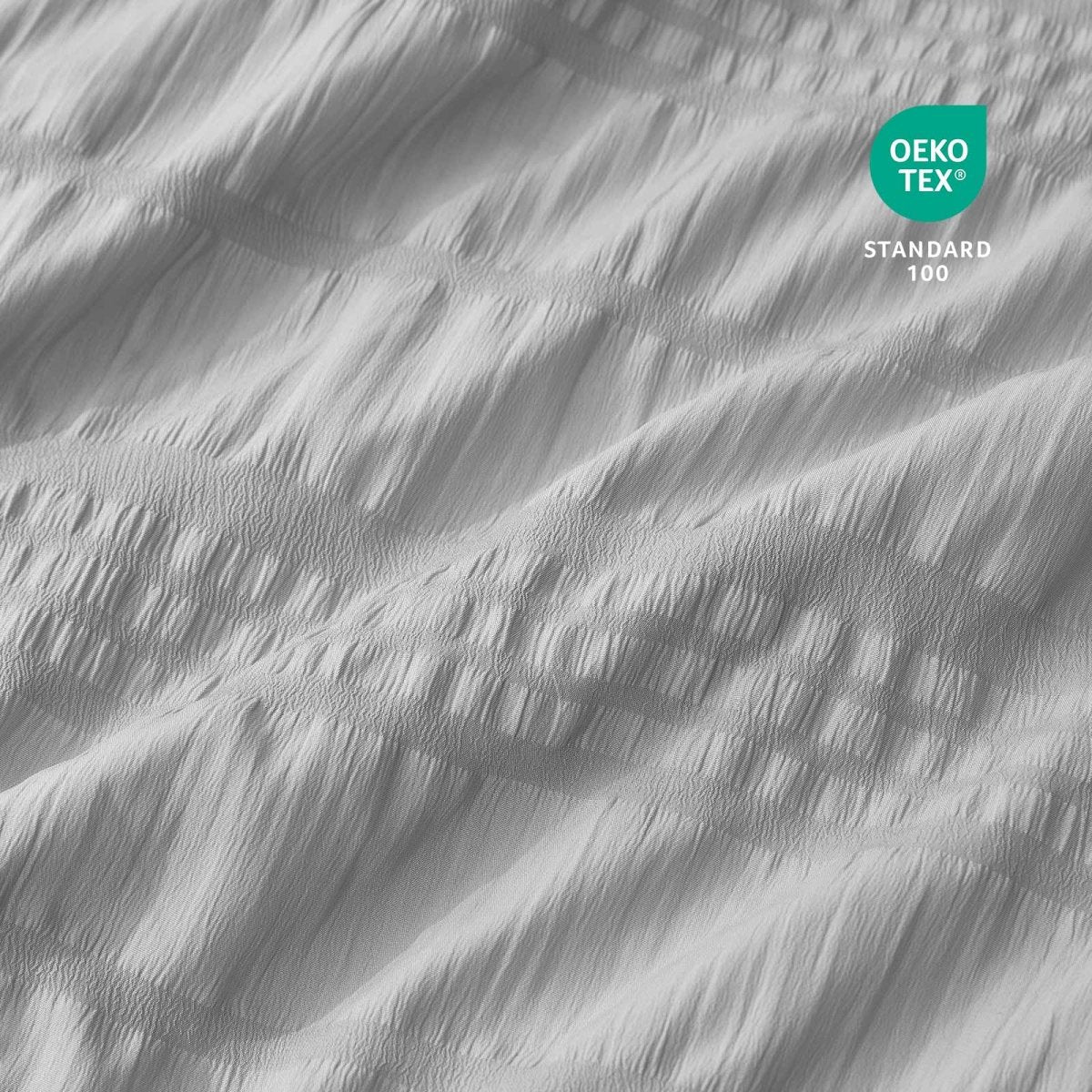Close-up of Cozy Bliss cooling fabric with OEKO-TEX Standard 100 certification.#color_Light Grey