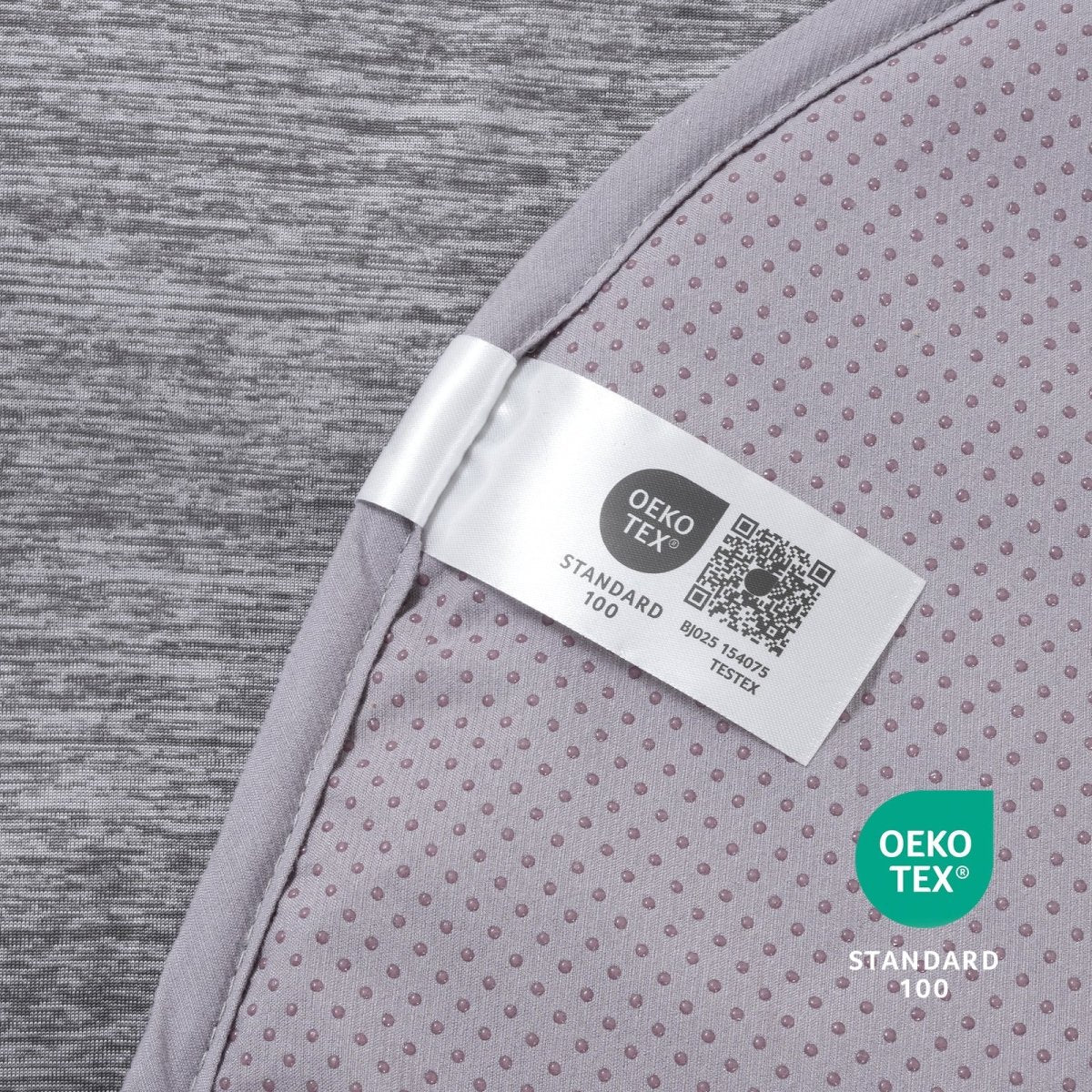 Oeko-Tex label on gray paw-shaped cooling pet mat fabric.#color_Grey