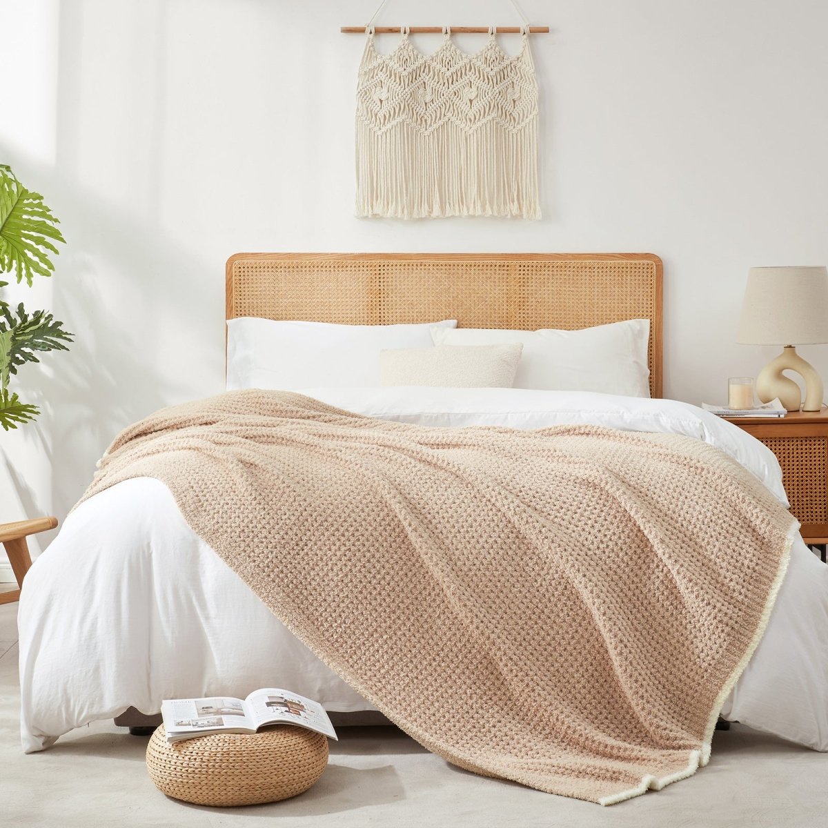 Soft Waffle Feather Yarn Throw Blanket in Light Brown styled on a bed, adding a warm and elegant layered look. #color_Light Brown