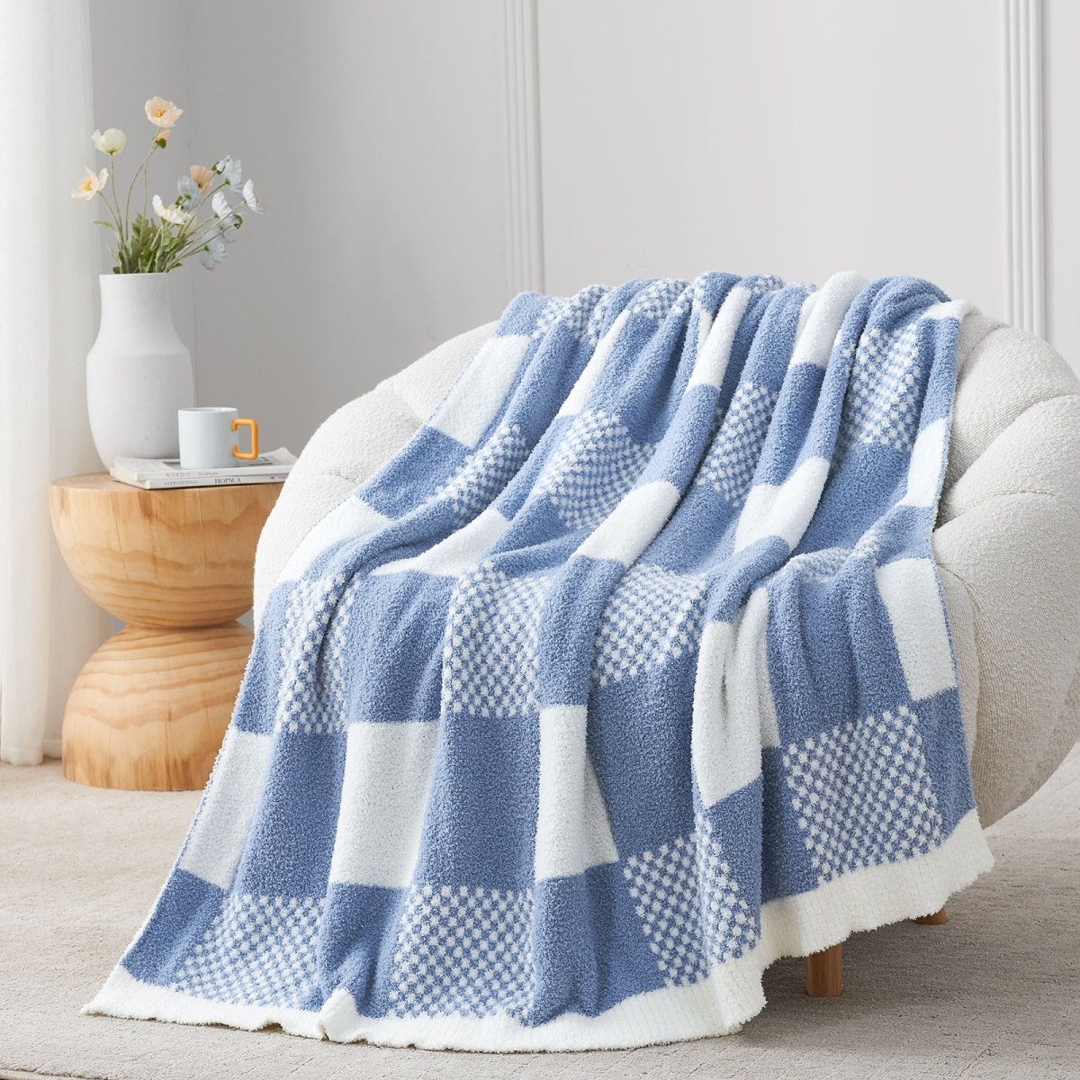 Checkered Feather Yarn Throw Blanket in Dark Blue front view draped over a chair, showcasing soft feather yarn texture and checkered pattern design. #color_Dark Blue