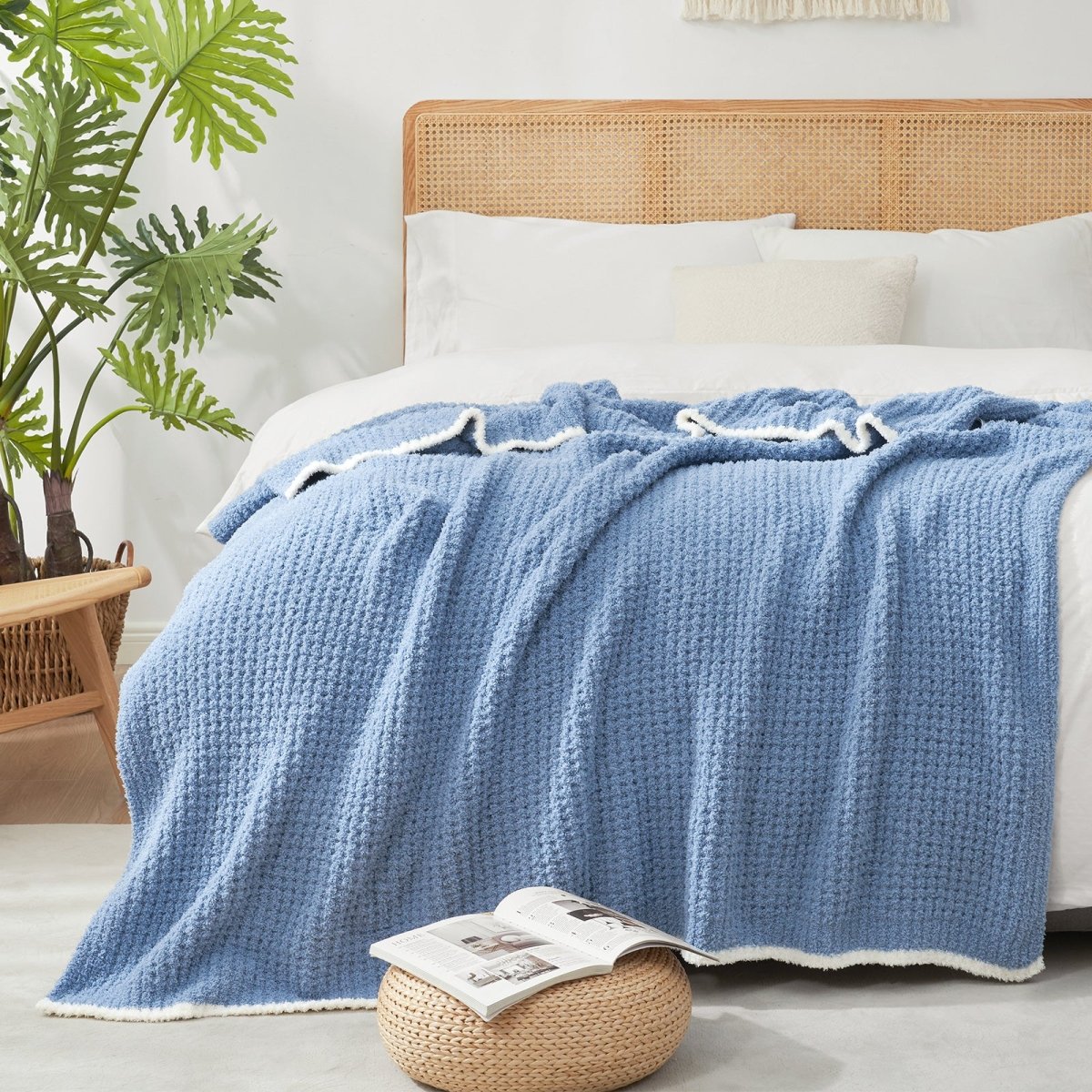 Soft Waffle Feather Yarn Throw Blanket in Dark Blue styled on a bed, adding a modern and cozy layered look. #color_Dark Blue