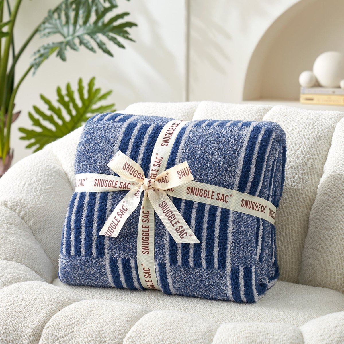 Reversible Heather Checkered Feather Yarn Throw Blanket in Navy neatly folded with ribbon, perfect as a cozy gift for holidays and special occasions. #color_Navy Blue