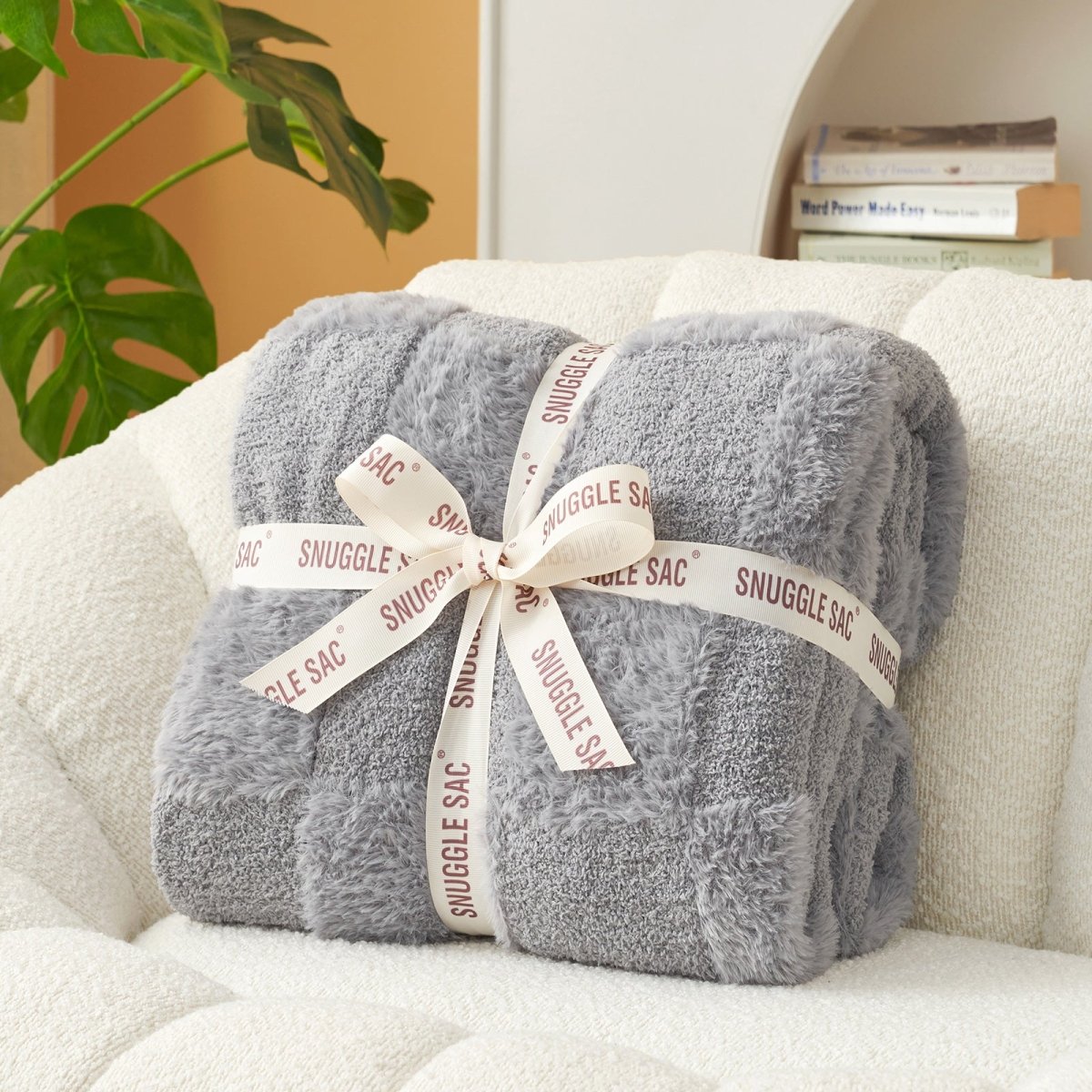 Checkered Faux Fur Feather Yarn Throw Blanket in Light Grey neatly folded with ribbon, perfect for gifting. #Color_Light Grey