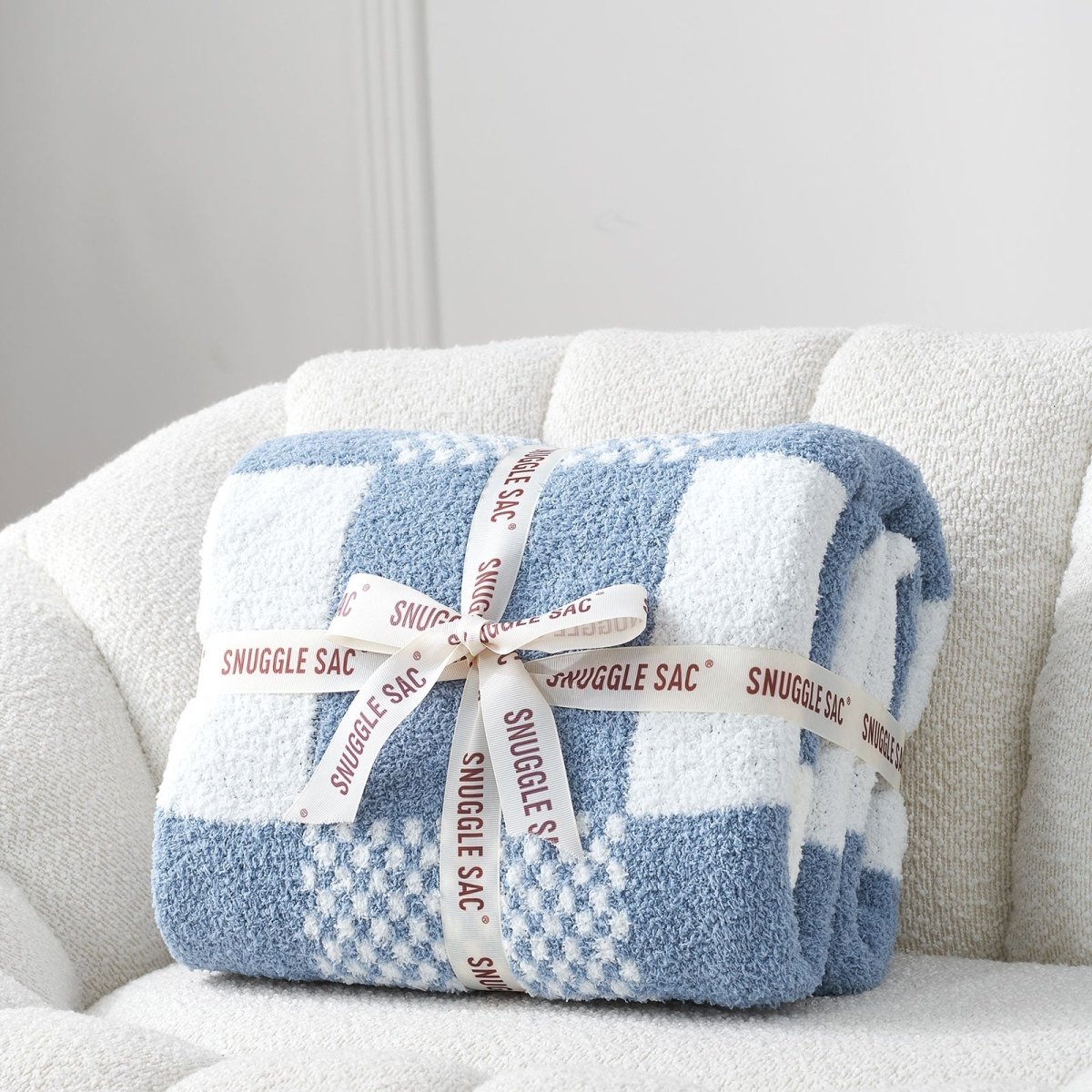 Checkered Feather Yarn Throw Blanket in Dark Blue neatly folded as gift packaging, perfect for holidays and special occasions. #color_Dark Blue