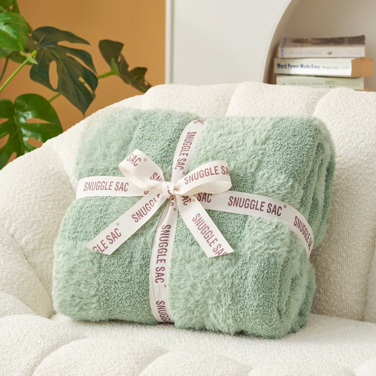 Checkered Faux Fur Feather Yarn Throw Blanket in Sage Green neatly folded with ribbon, perfect for gifting. #color_Sage Green