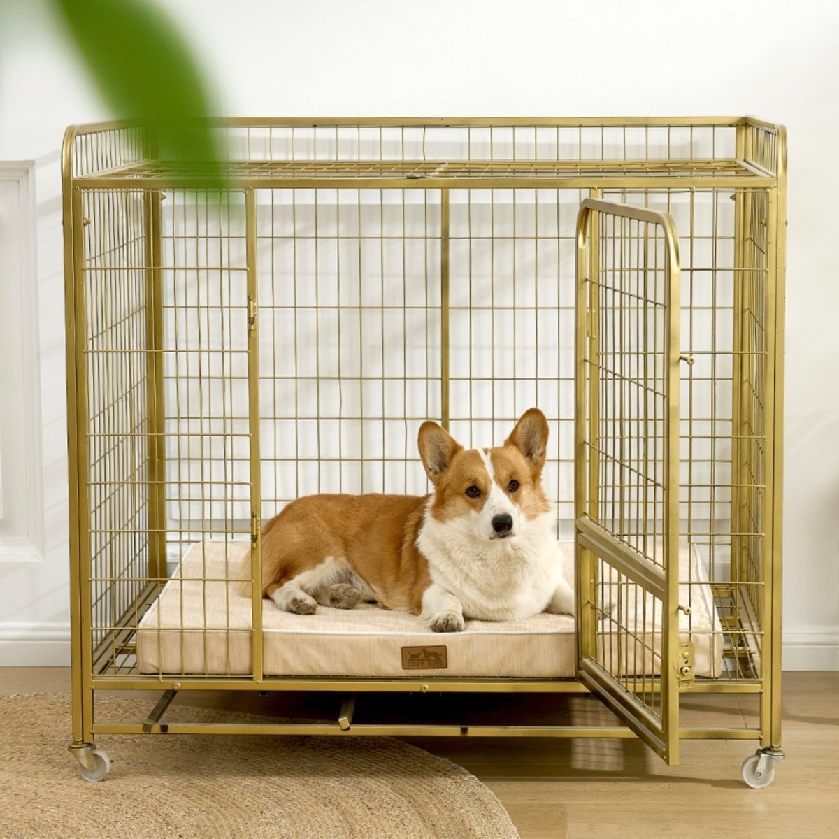 Dog lying on a cooling cushion inside a gold metal dog crate.#color_Beige