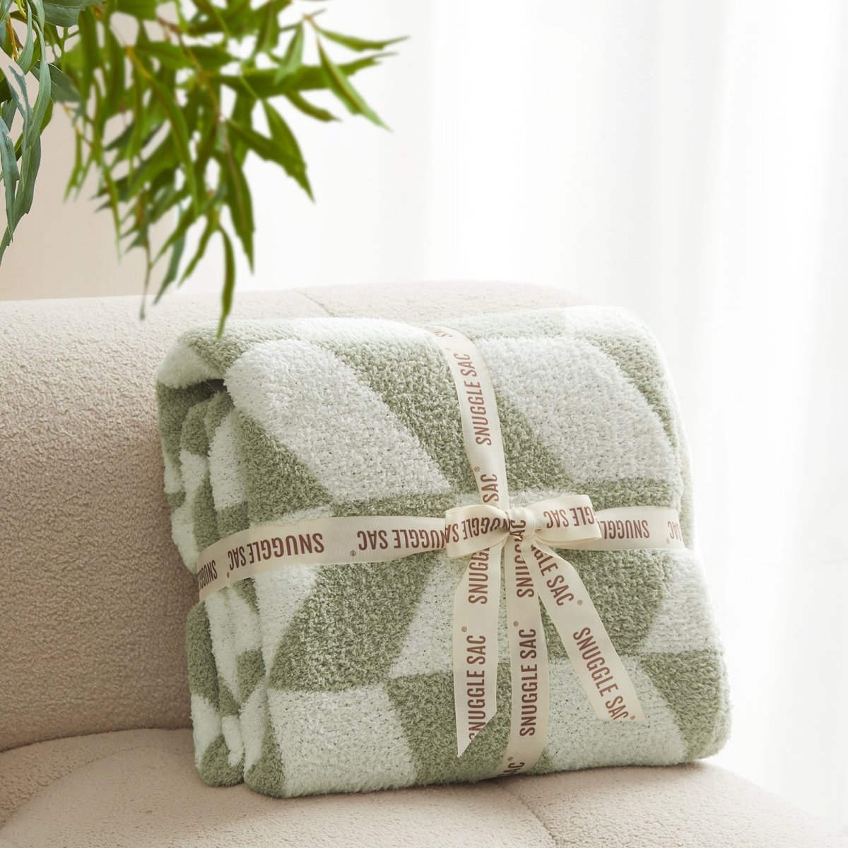 Chevron Feather Yarn Knit Throw Blanket in Sage Green neatly folded with ribbon packaging, perfect as a cozy gift for holidays and special occasions. #color_Sage Green