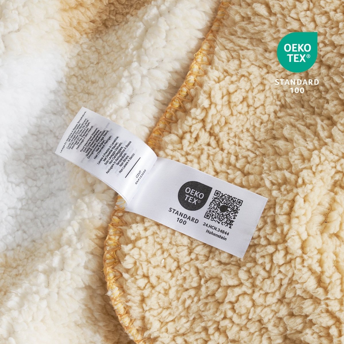 Close up of buffalo sherpa throw blanket in Buffalo Plaid-beige, showcasing soft sherpa texture and OEKO TEX STANDARD 100 certification #color_Buffalo Plaid-beige