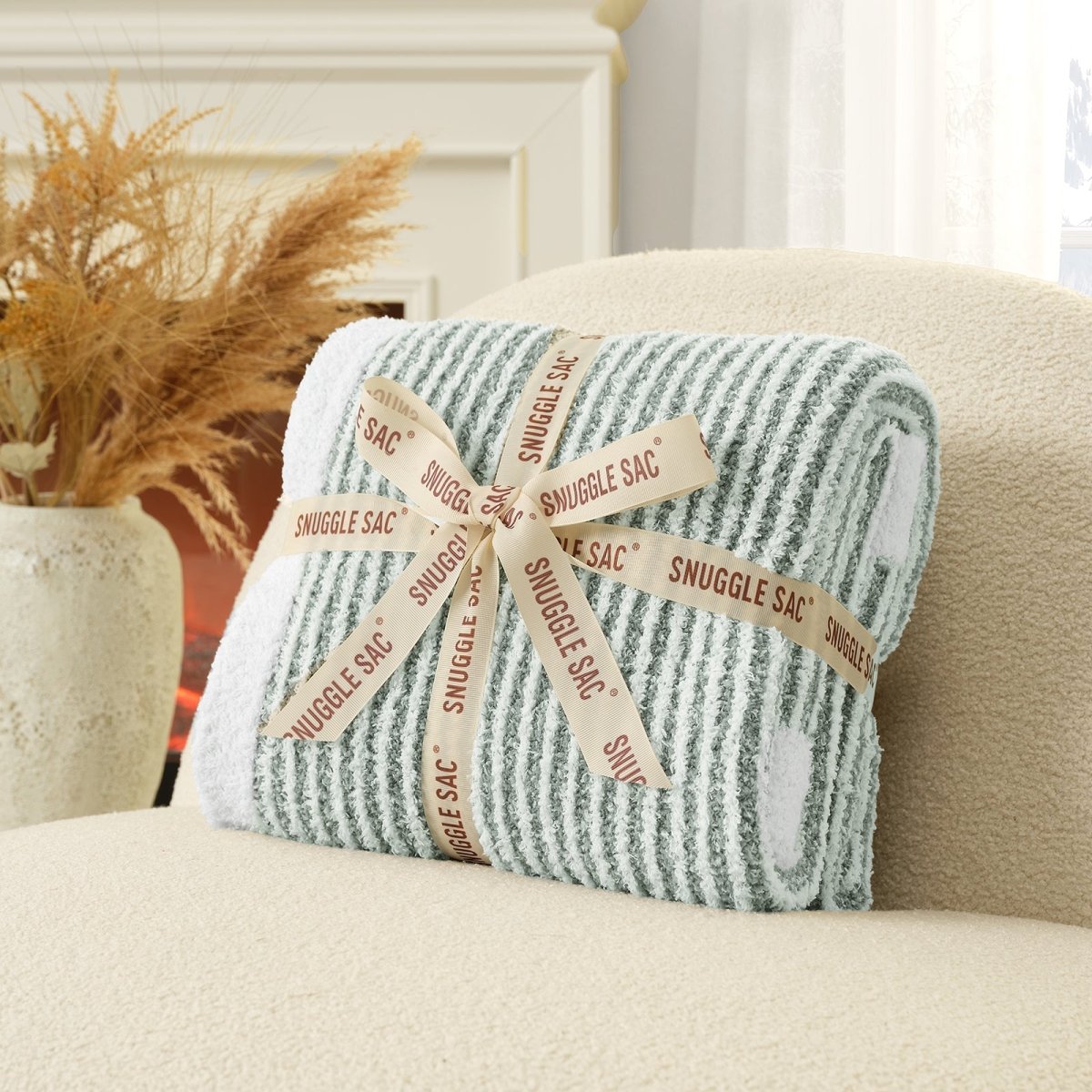 Soft Ribbed Feather Yarn Throw Blanket in Sage Green neatly folded with ribbon packaging, showcasing soft texture and perfect giftable design. #color_Sage Green