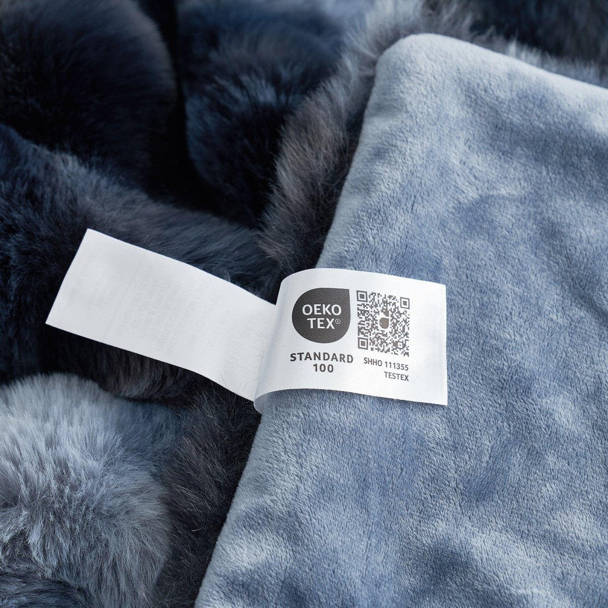 Close-up of OEKO-TEX certified faux fur tie-dye blue blanket fabric. #color_Tie-dye Blue
