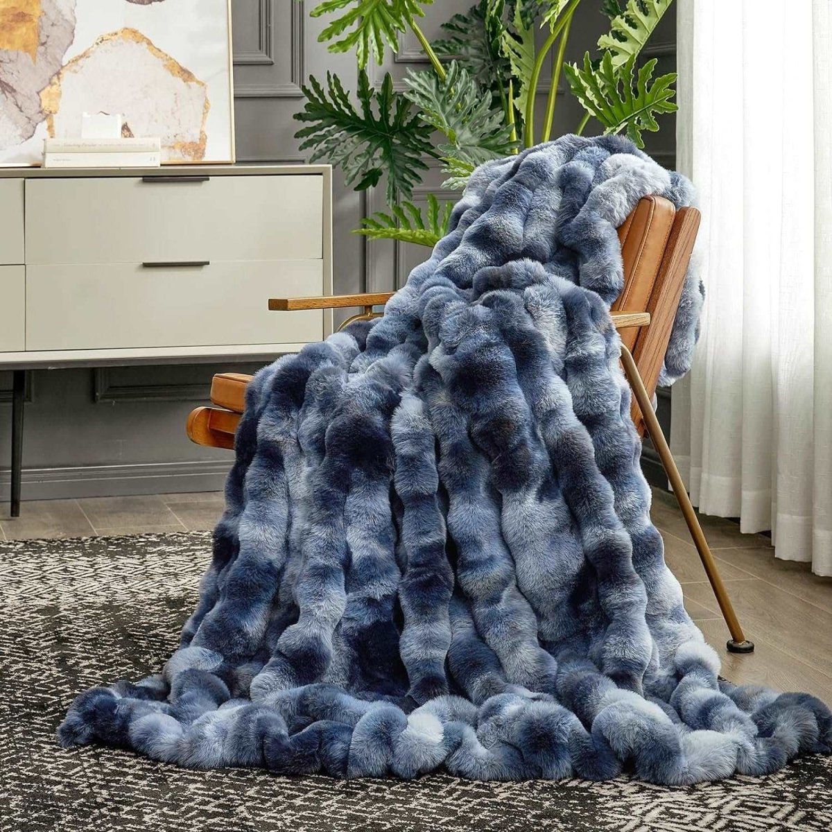 Cozy Bliss Bubble Faux Fur Throw Blanket in tie-dye blue, draped on a chair for cozy comfort #color_Tie-dye Blue